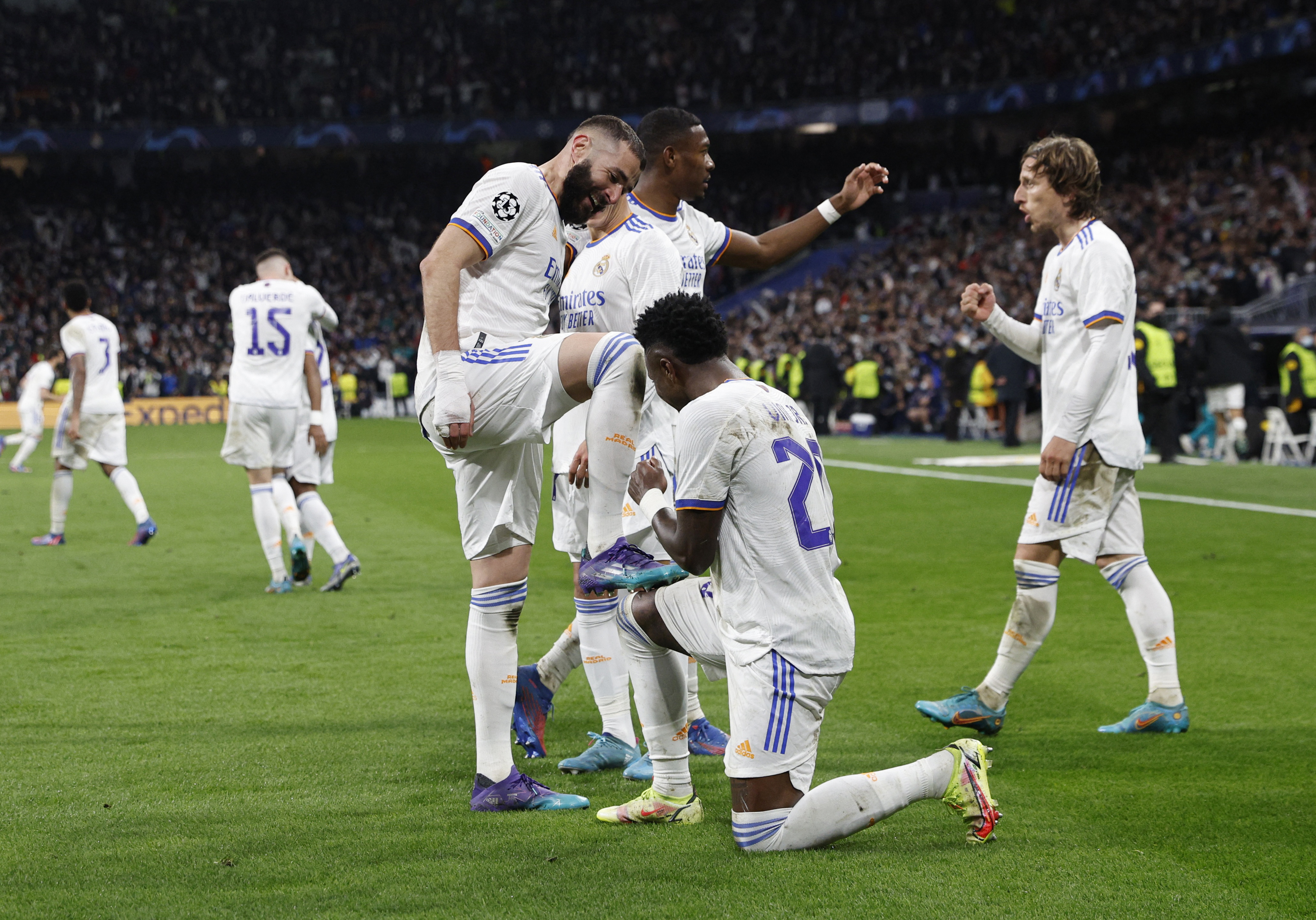 Soccer Football - Champions League - Round of 16 Second Leg - Real Madrid v Paris St Germain - Santiago Bernabeu, Madrid, Spain - March 9, 2022 Real Madrid's Karim Benzema celebrates scoring their third goal with Vinicius Junior REUTERS/Susana Vera