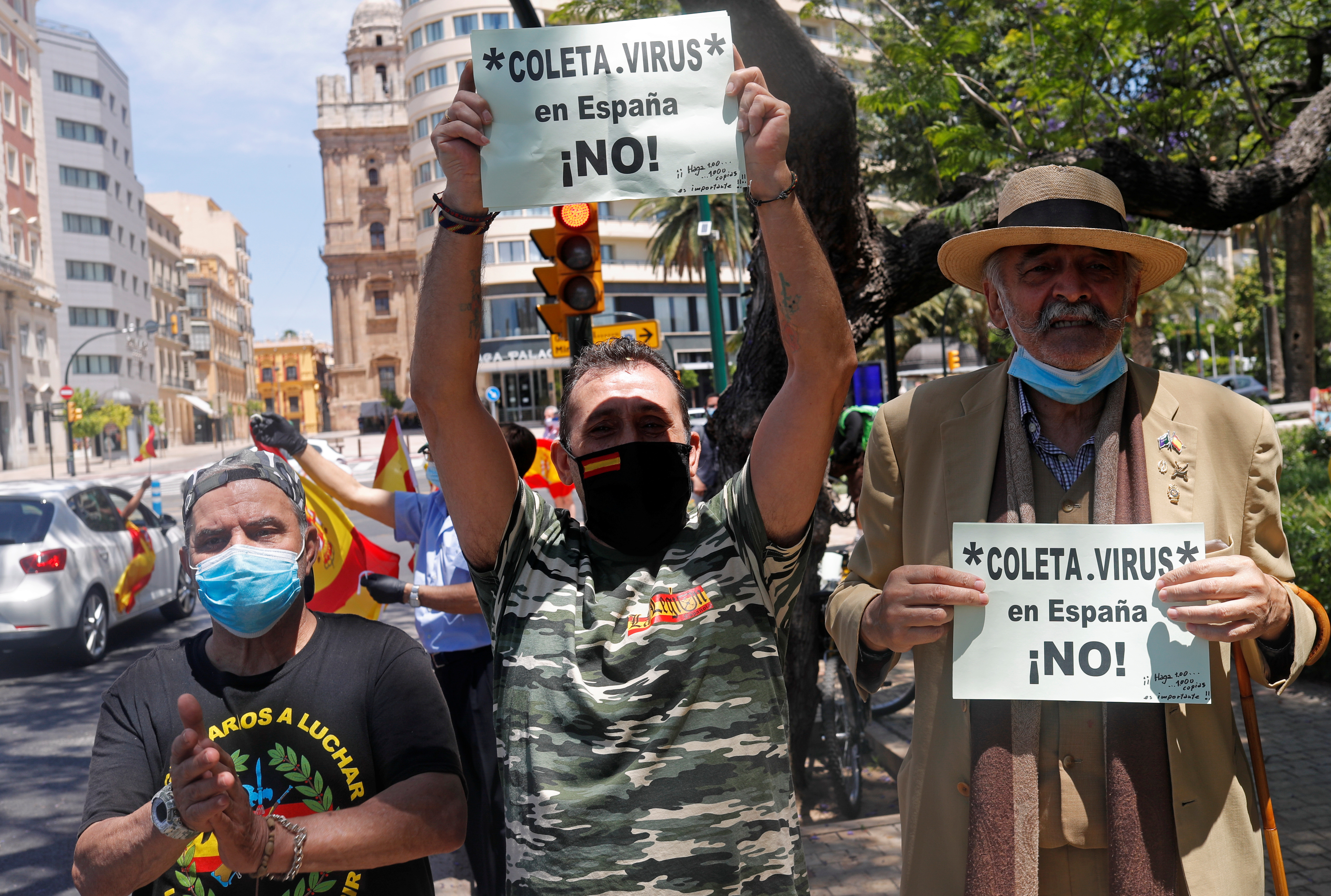 Demonstrators watch a drive-in protest organised by Spain's far-right party Vox against the government's handling of the coronavirus disease (COVID-19) outbreak, in Malaga, southern Spain, May 23, 2020. REUTERS/Jon Nazca