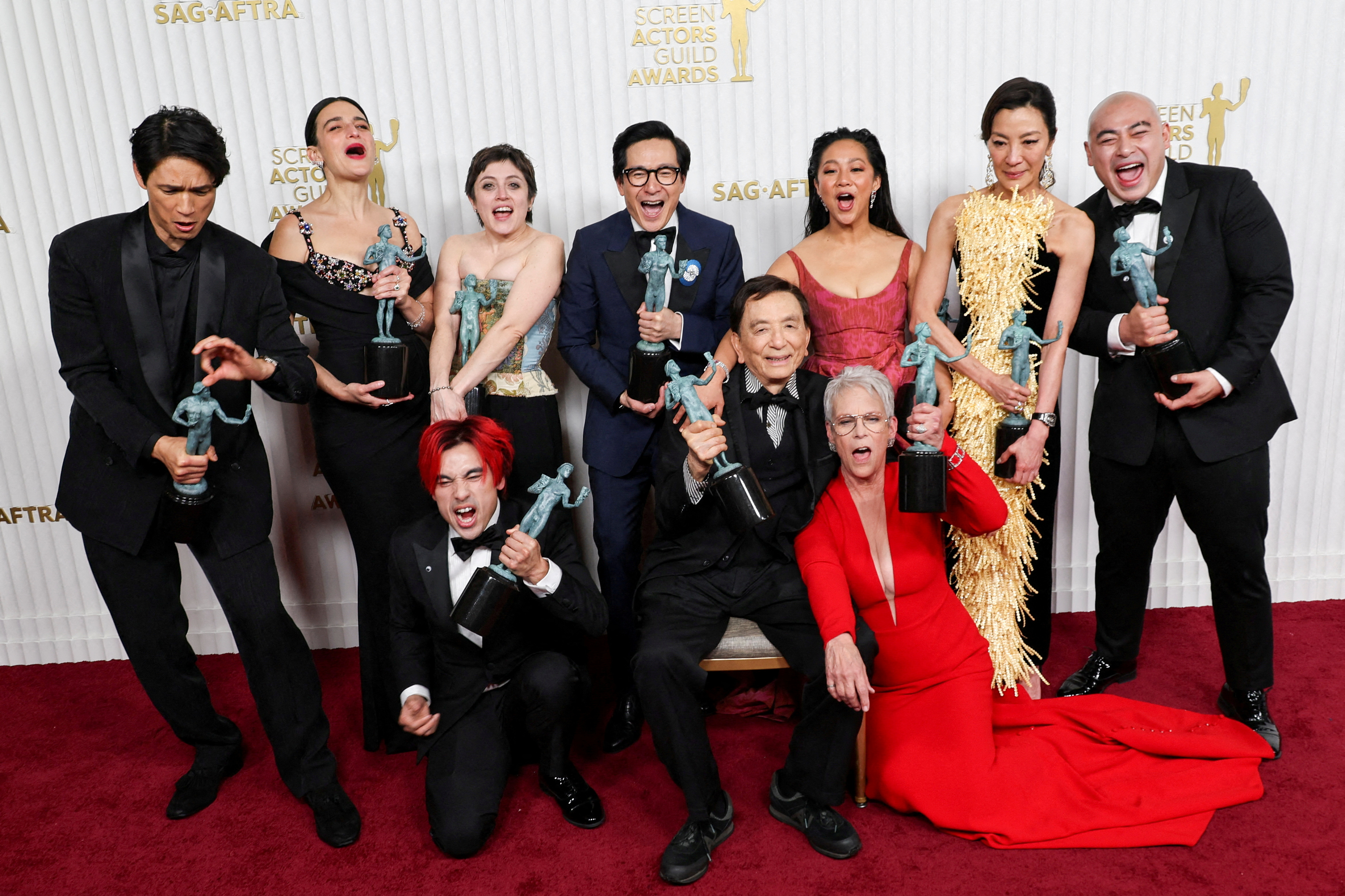 FILE PHOTO: Members of the cast of "Everything Everywhere All at Once" Harry Shum Jr., Jenny Slate, Andy Le, Tallie Medel, Ke Huy Quan, James Hong, Stephanie Hsu, Jamie Lee Curtis, Michelle Yeoh and Brian Le, pose with the award for Outstanding Performance by a Cast in a Motion Picture during the 29th Screen Actors Guild Awards at the Fairmont Century Plaza Hotel in Los Angeles, California, U.S., February 26, 2023. REUTERS/Aude Guerrucci/File Photo/File Photo
