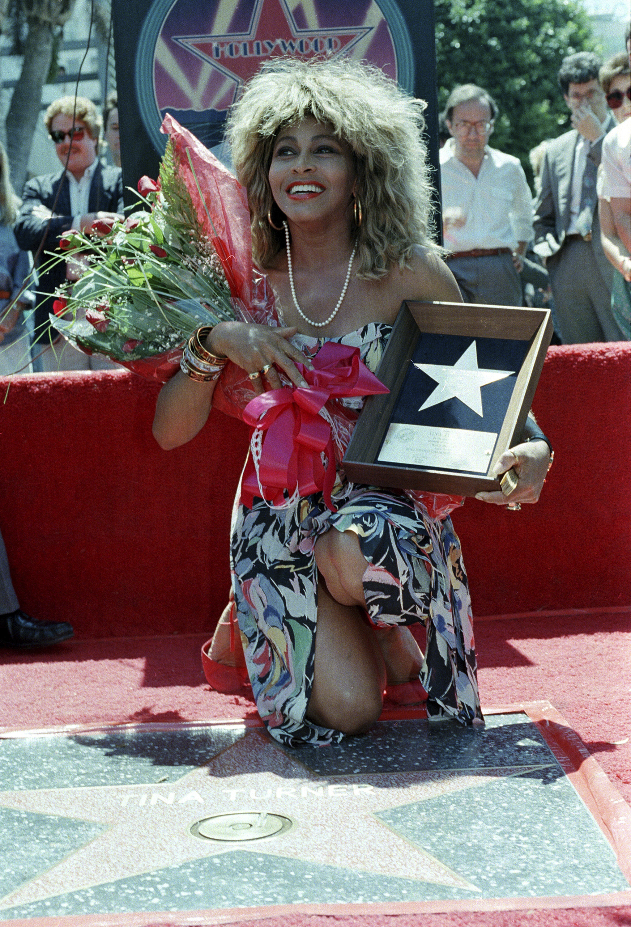 Tina Turner on the Hollywood Walk of Fame during her plaque unveiling ceremony on August 28, 1986, in Los Angeles.  (PHOTO: AP/Nick Ut)