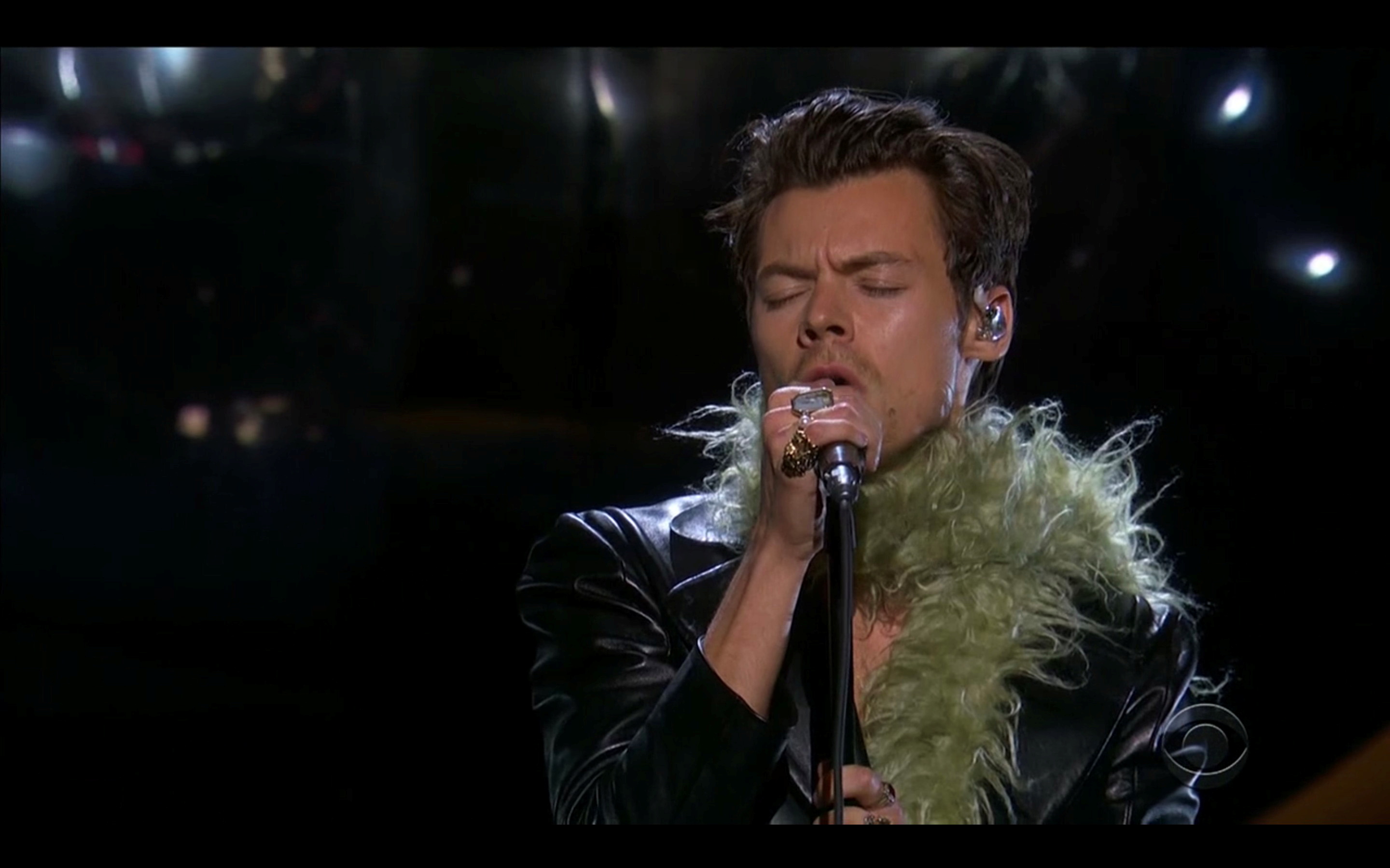 Harry Styles performs in this screen grab taken from video of the 63rd Annual Grammy Awards in Los Angeles, California, U.S., March 14, 2021. CBS/Handout via REUTERS - ATTENTION EDITORS - THIS IMAGE HAS BEEN SUPPLIED BY A THIRD PARTY. NO ARCHIVES, NO SALES, MANDATORY CREDIT, NO NEW USES AFTER 0400 GMT 17/3/2021, NO BROADCAST USE, USE FOR GRAMMY RELATED COVERAGE ONLY