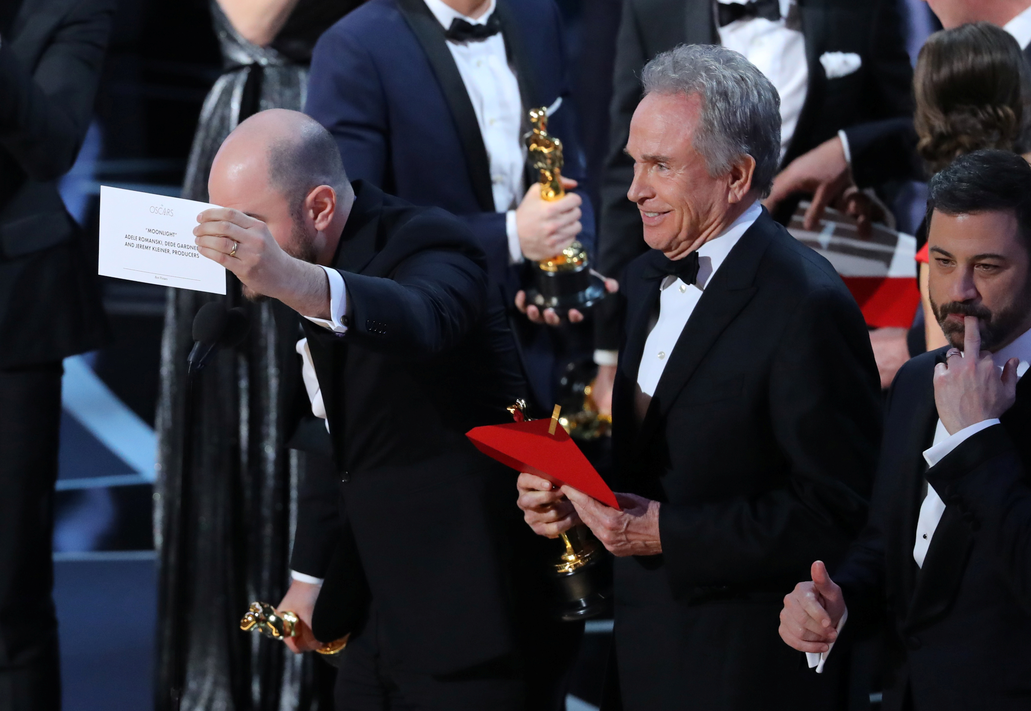 Jordan Horowitz of "La La Land" holds the card announcing "Moonlight" as the winner of the Oscar for Best Picture Warren Beatty and Jimmy Kimmel (Reuters)