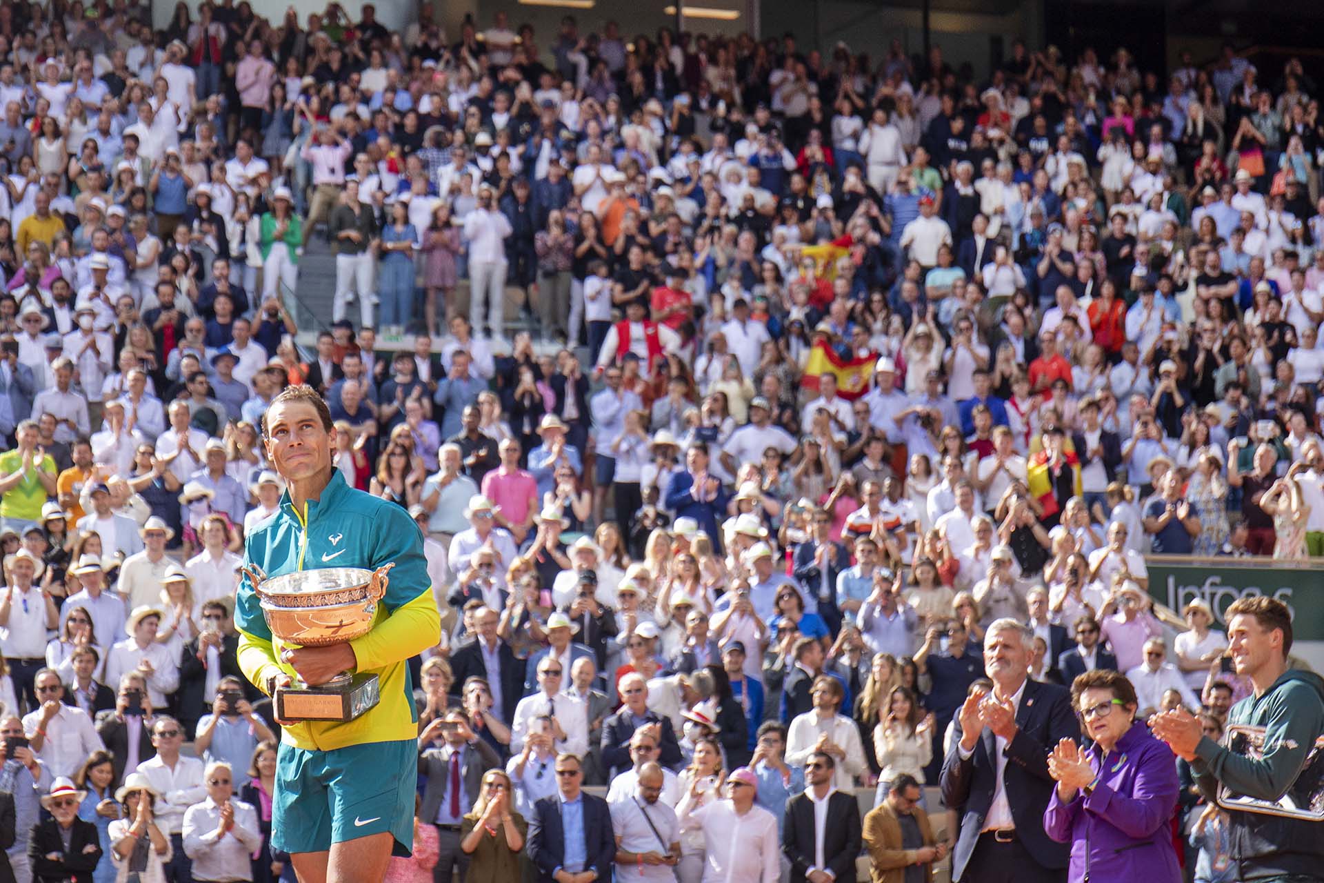PARIS, FRANCE JUNE 5.  Rafael Nadal of Spain with the winners trophy watched by French Tennis Federation President Gilles Moretton, Billie Jean King and Casper Rudd after his victory against Casper Rudd of Norway during the Singles Final for Men on Court Philippe Chatrier at the 2022 French Open Tennis Tournament at Roland Garros on June 5th 2022 in Paris, France. (Photo by Tim Clayton/Corbis via Getty Images)