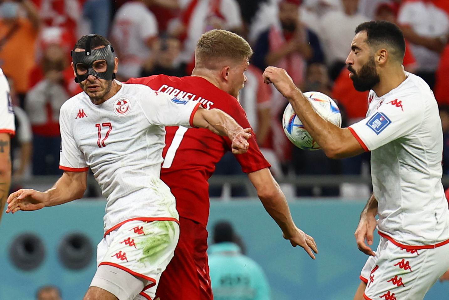 Soccer Football - FIFA World Cup Qatar 2022 - Group D - Denmark v Tunisia - Education City Stadium, Al Rayyan, Qatar - November 22, 2022 The ball appears to hit the arm of Tunisia's Yassine Meriah before referee Cesar Arturo Ramos checks the VAR screen and rules it accidental and no penalty REUTERS/Kai Pfaffenbach