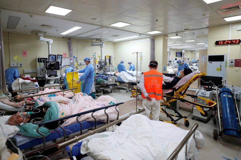 Medical workers attend to patients in the intensive care unit of the emergency department of Beijing Chaoyang Hospital, during the COVID-19 outbreak. 