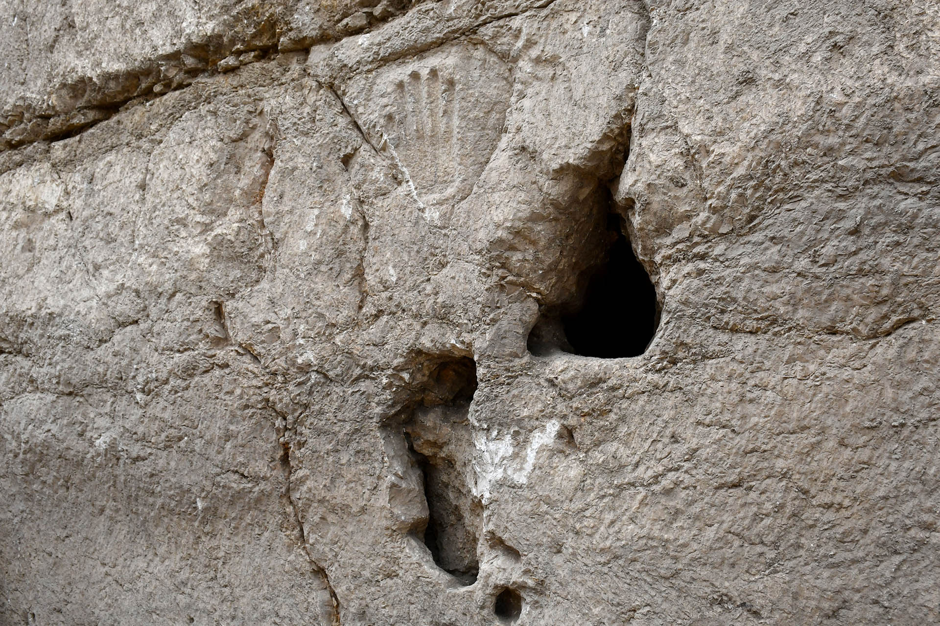 Got a picture of the carved hand.  (Photo: Israel Antiquities Authority / AFP) 