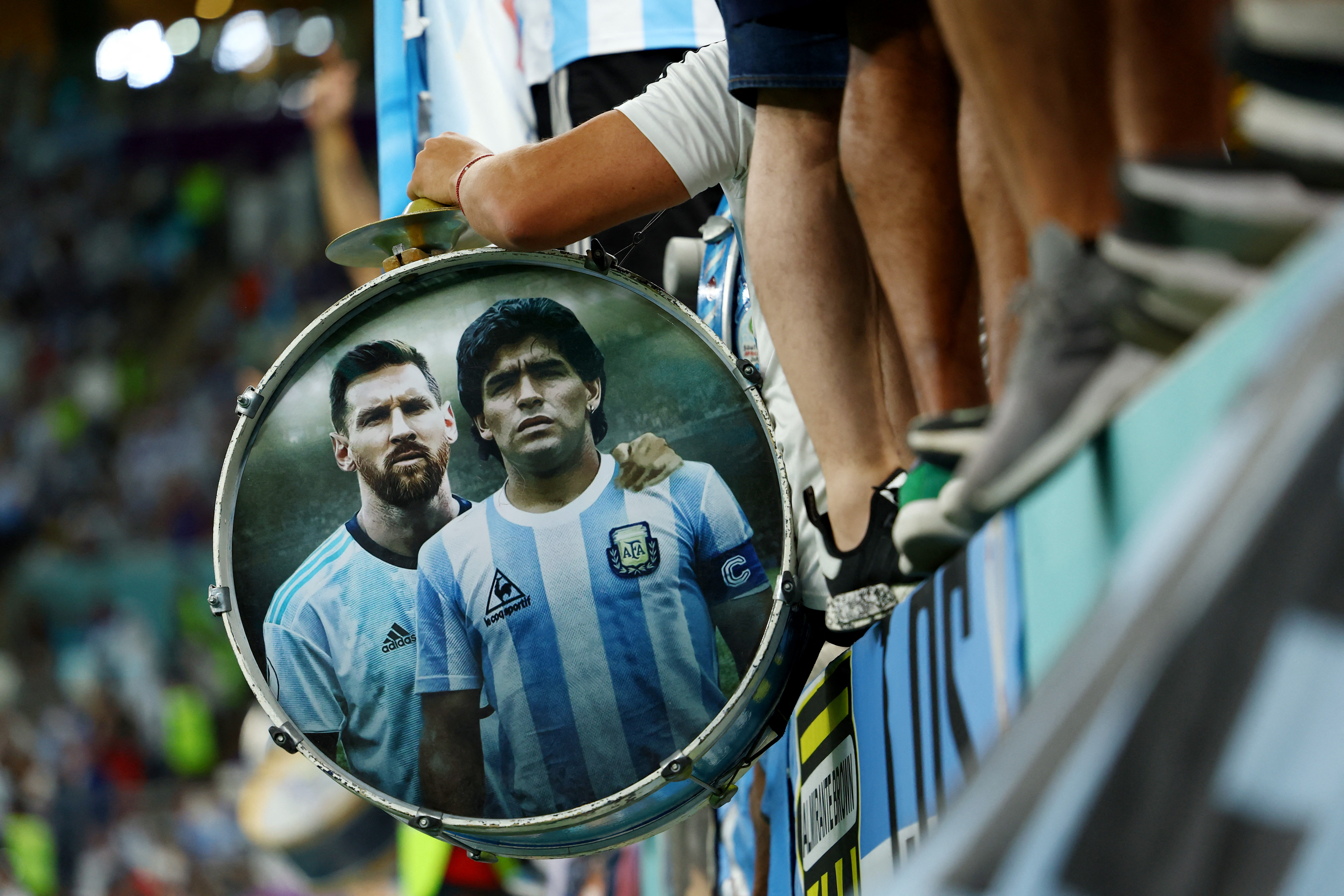 Soccer Football - FIFA World Cup Qatar 2022 - Quarter Final - Netherlands v Argentina - Lusail Stadium, Lusail, Qatar - December 9, 2022 Argentina's Lionel Messi and Diego Maradona are pictured in a fans drum inside the stadium before the match REUTERS/Molly Darlington