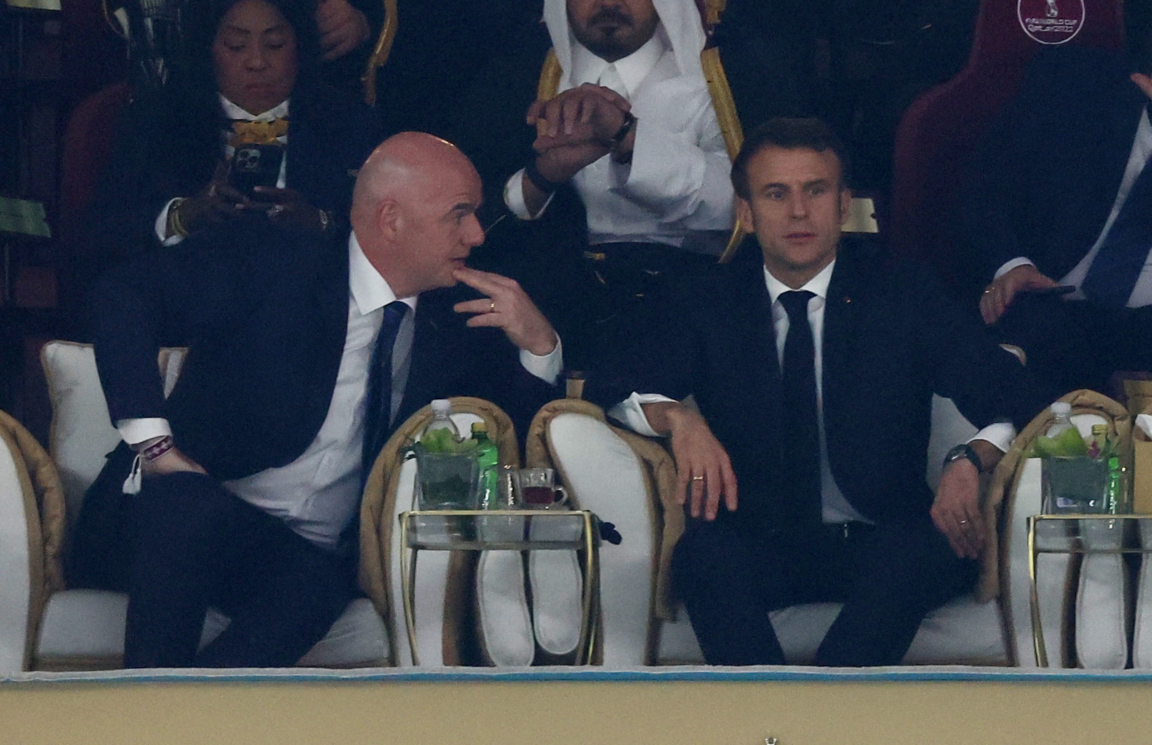 Soccer Football - FIFA World Cup Qatar 2022 - Final - Argentina v France - Lusail Stadium, Lusail, Qatar - December 18, 2022 FIFA president Gianni Infantino and French President Emmanuel Macron are pictured in the stands before the match REUTERS/Lee Smith