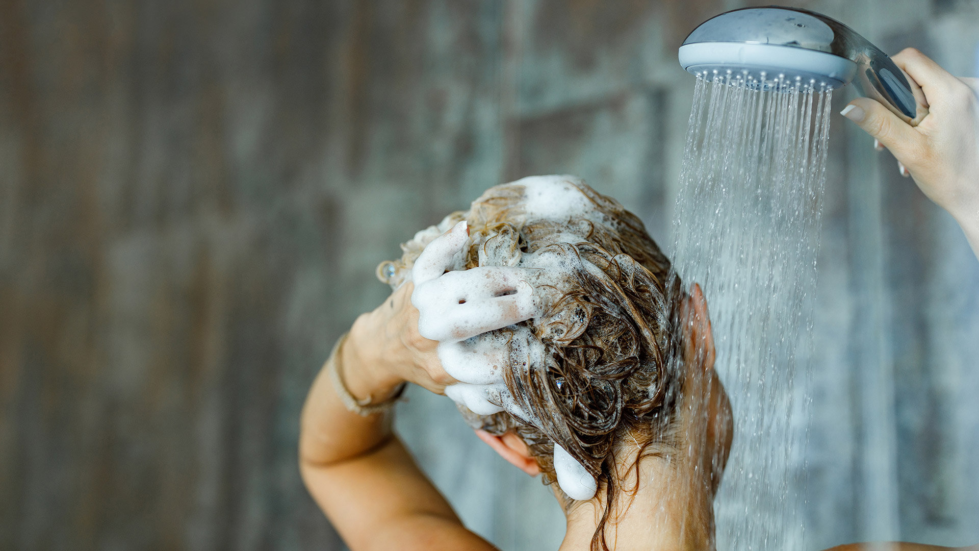 To combat dandruff, first try washing your hair daily with a mild shampoo.  (File, Archive)