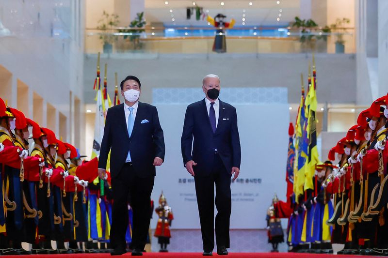 US President Joe Biden and South Korean President Yoon Suk-youl are greeted by a guard of honor during a state dinner at the National Museum of Korea in Seoul, South Korea.