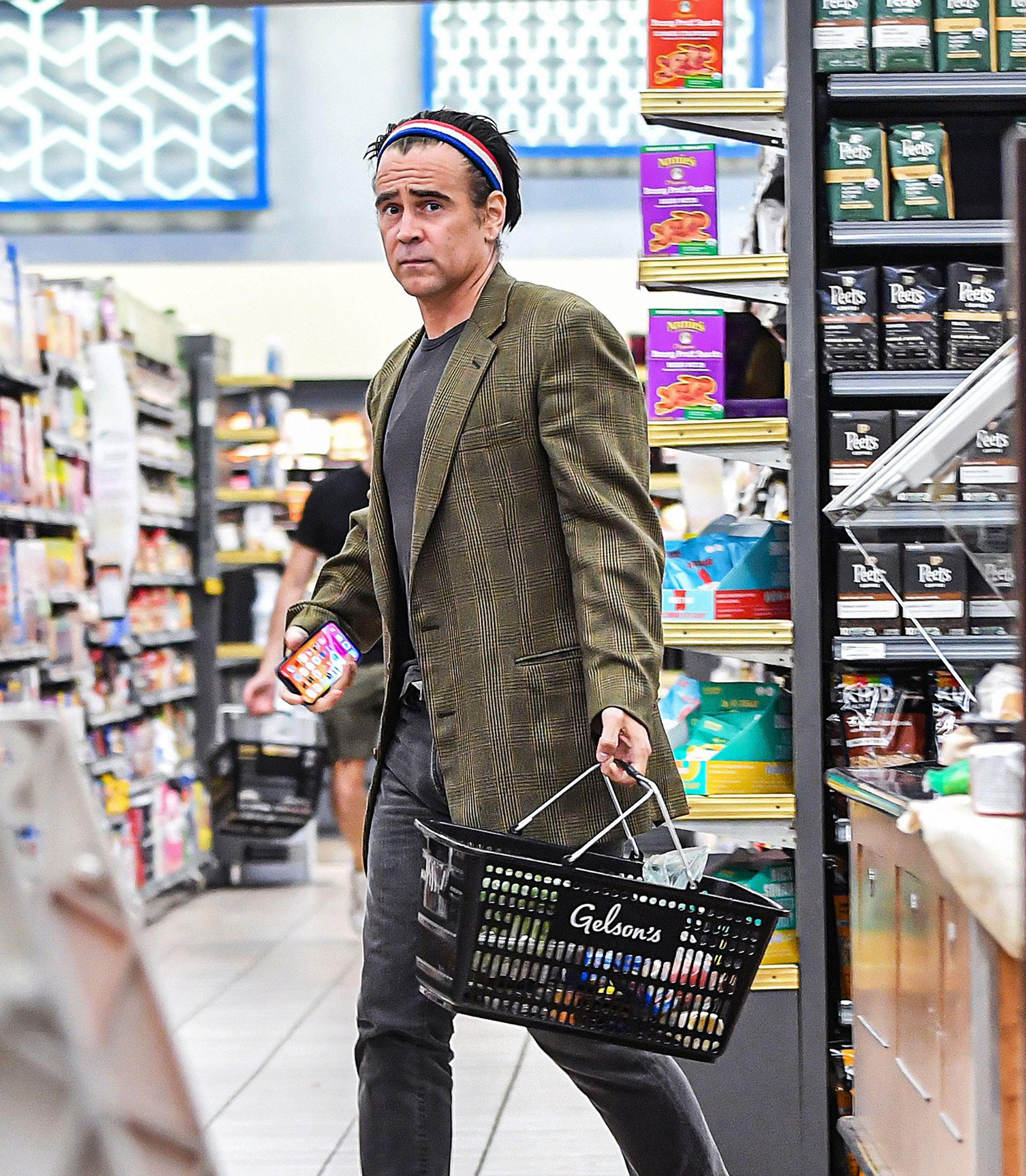 Colin Farrell was photographed doing his daily shopping at a Los Angeles supermarket.  The actor wore a casual look of jeans and a shirt, and a checkered jacket.  In addition, he wore a colored headband to hold his hair