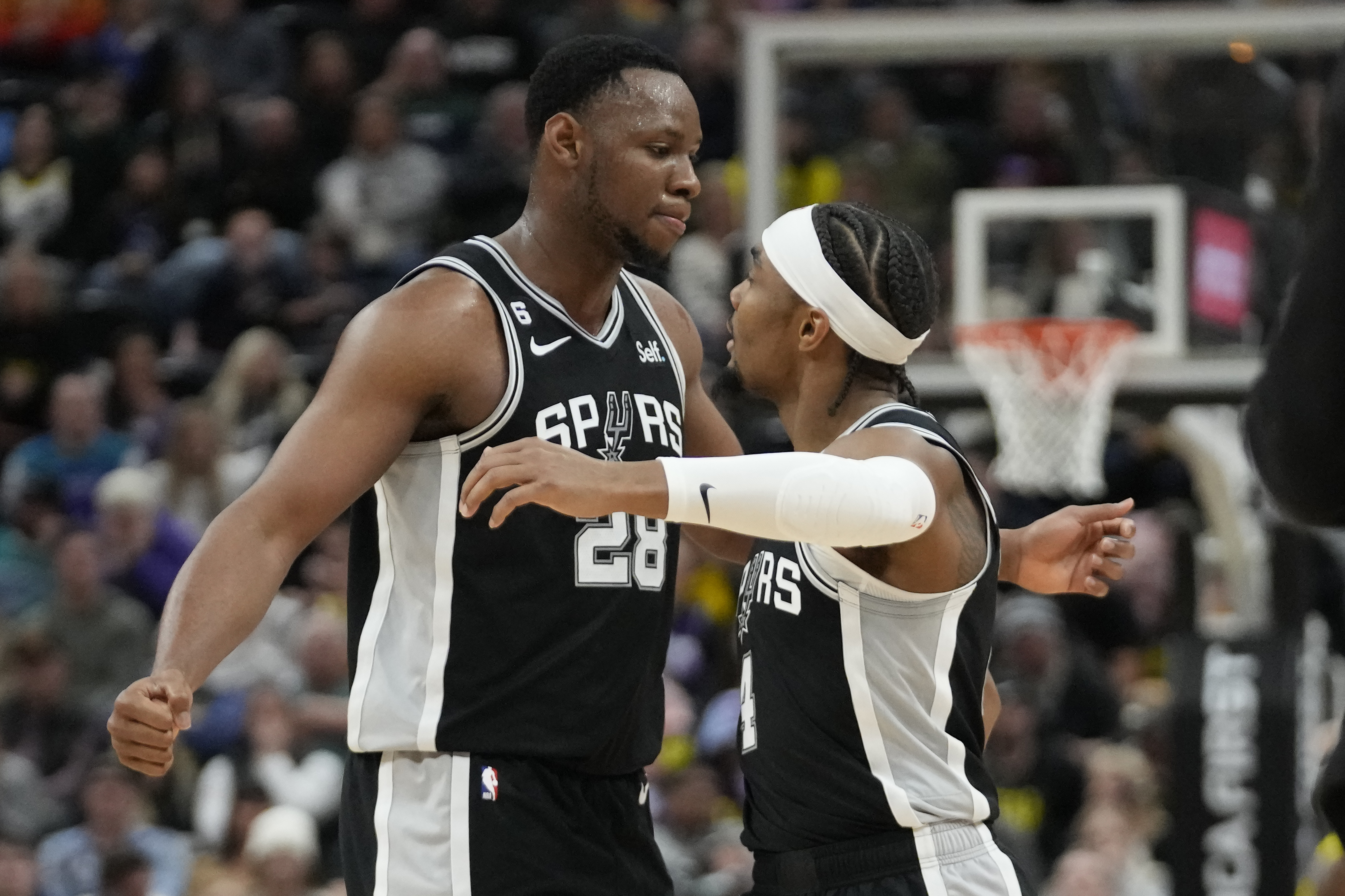 Charles Bassey and Devonte Graham of the San Antonio Spurs celebrate during a game against the Utah Jazz, Tuesday, Feb. 28, 2023. (AP Photo/Rick Bowmer)