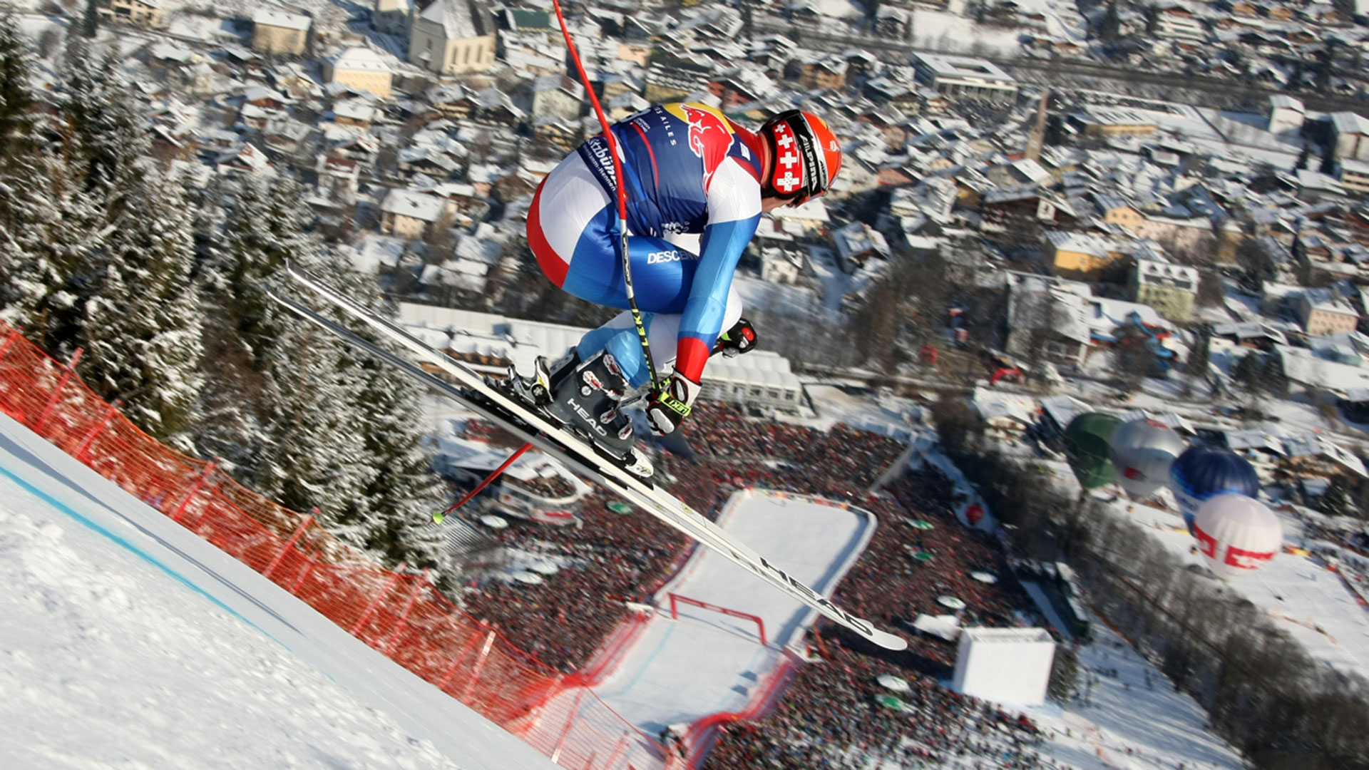 Five-time Hahnenkamm champion Didier Cuche soars through the air on the Streif above the town of Kitzbuhel, Austria (Kitzbuehel Hahnenkamm)