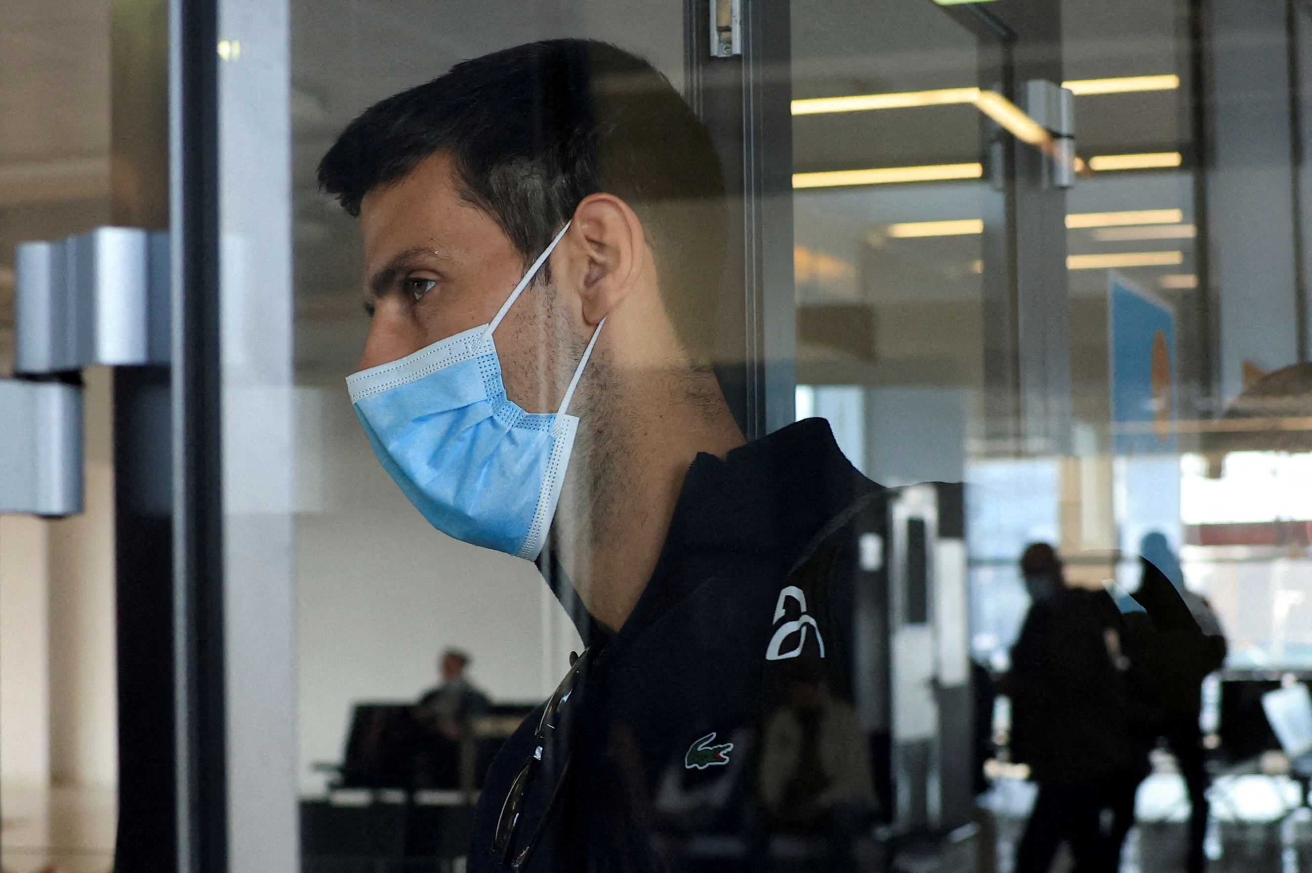 FILE PHOTO: Serbian tennis player Novak Djokovic arrives at Nikola Tesla Airport, after the Australian Federal Court upheld a government decision to cancel his visa to play in the Australian Open, in Belgrade, Serbia January 17, 2022. REUTERS/Christopher Pike     TPX IMAGES OF THE DAY/File Photo