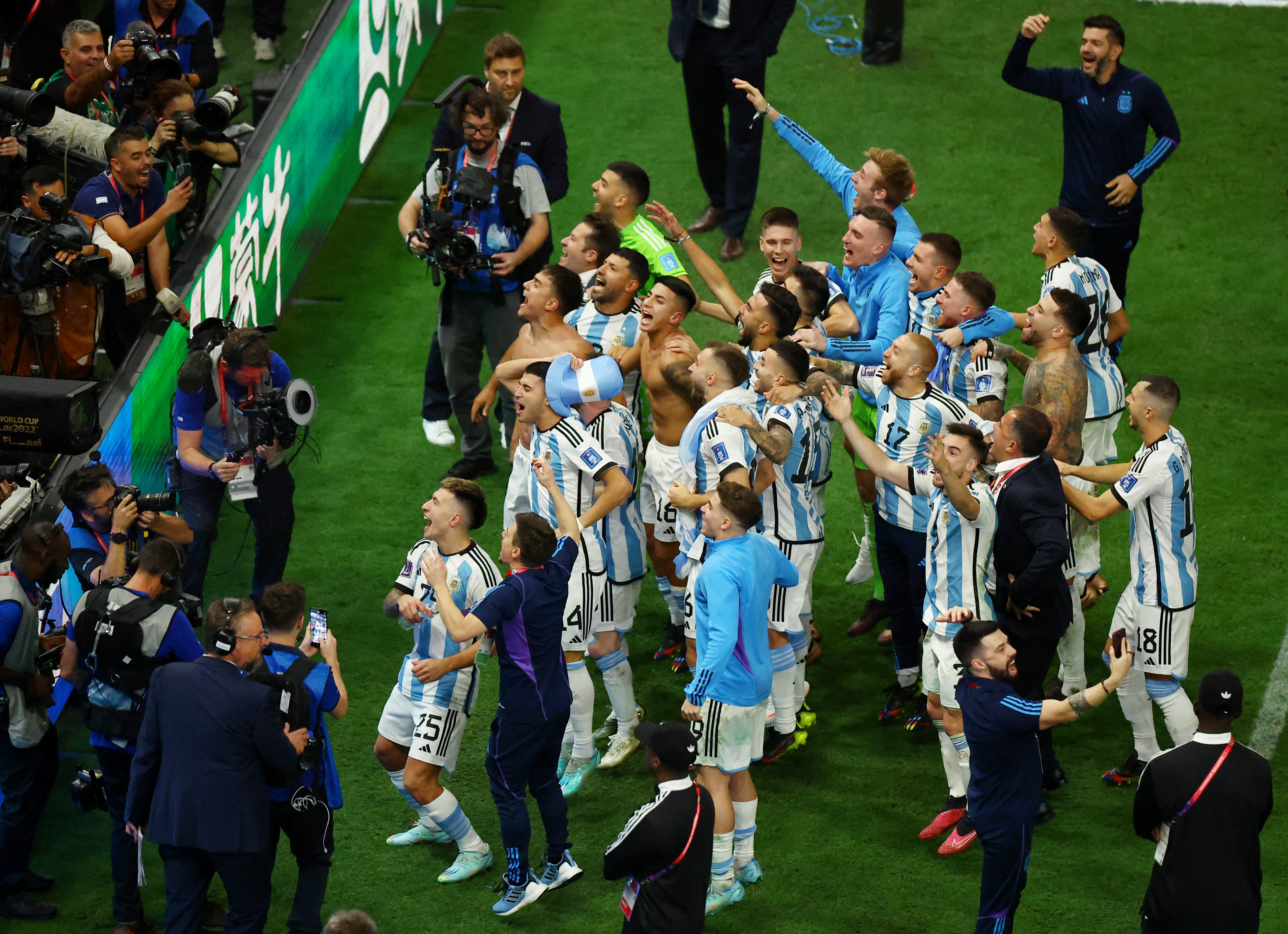 Soccer Football - FIFA World Cup Qatar 2022 - Final - Argentina v France - Lusail Stadium, Lusail, Qatar - December 18, 2022 Argentina players celebrate winning the World Cup after the penalty shootout REUTERS/Molly Darlington