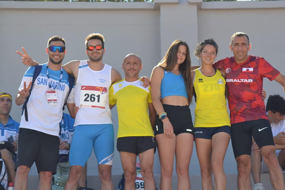 Vatican City athletes (in yellow) pictured with athletes from San Marino and Gibraltar. Photo Credit: Athletica Vaticana