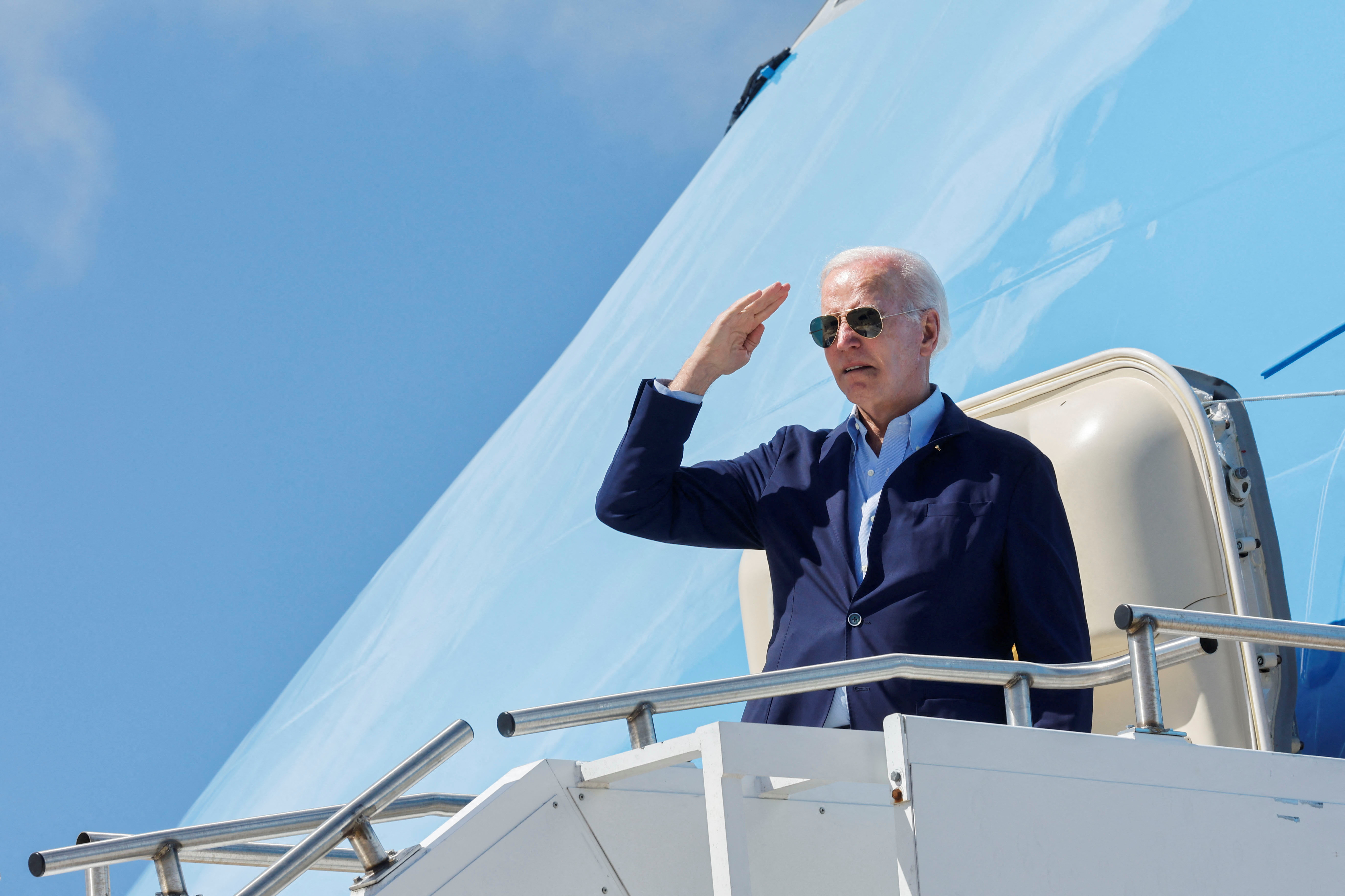 US President Joe Biden gestures as he boards Air Force One at Rohlsen Airport to depart after a New Year holiday visit to Christiansted, St. Croix, US Virgin Islands, US January 2, 2023. REUTERS/Jonathan Ernst