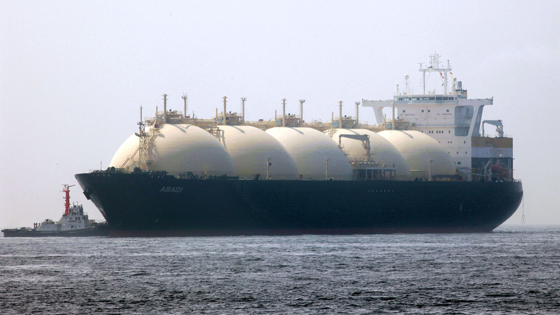 A liquefied-natural-gas (LNG) tanker, leaves a berth in Yokohama City, Kanagawa Prefecture, Japan, on Saturday, June 20, 2009. The world LNG market is likely to face supply shortages around 2013 as new projects fail to keep pace with supply, according to Wood Mackenzie, a U.K. energy research and consulting company. Photographer: Kimimasa Mayama/Bloomberg News