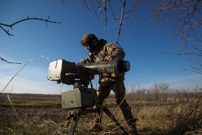 A Ukrainian serviceman prepares an anti-tank guided missile launcher at a front line, amid Russia's attack on Ukraine, in the Donetsk region