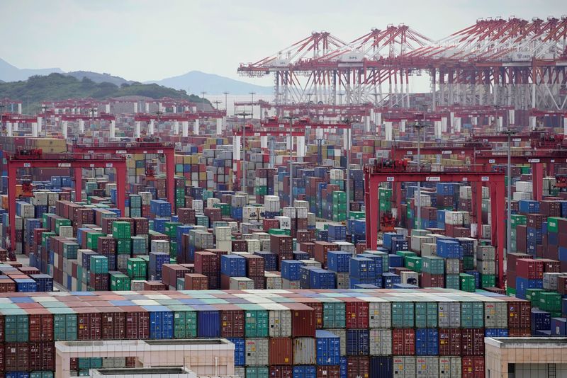 FILE PHOTO: Containers are seen at the Yangshan deepwater port in Shanghai, China October 19, 2020. REUTERS/Aly Song