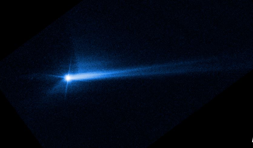 Dieses Bild, das am 8. Oktober 2022 vom Hubble-Weltraumteleskop der NASA aufgenommen wurde, zeigt Trümmer, die von der Oberfläche von Dimorphos entfernt wurden (NASA/ESA/STScI/Hubble).