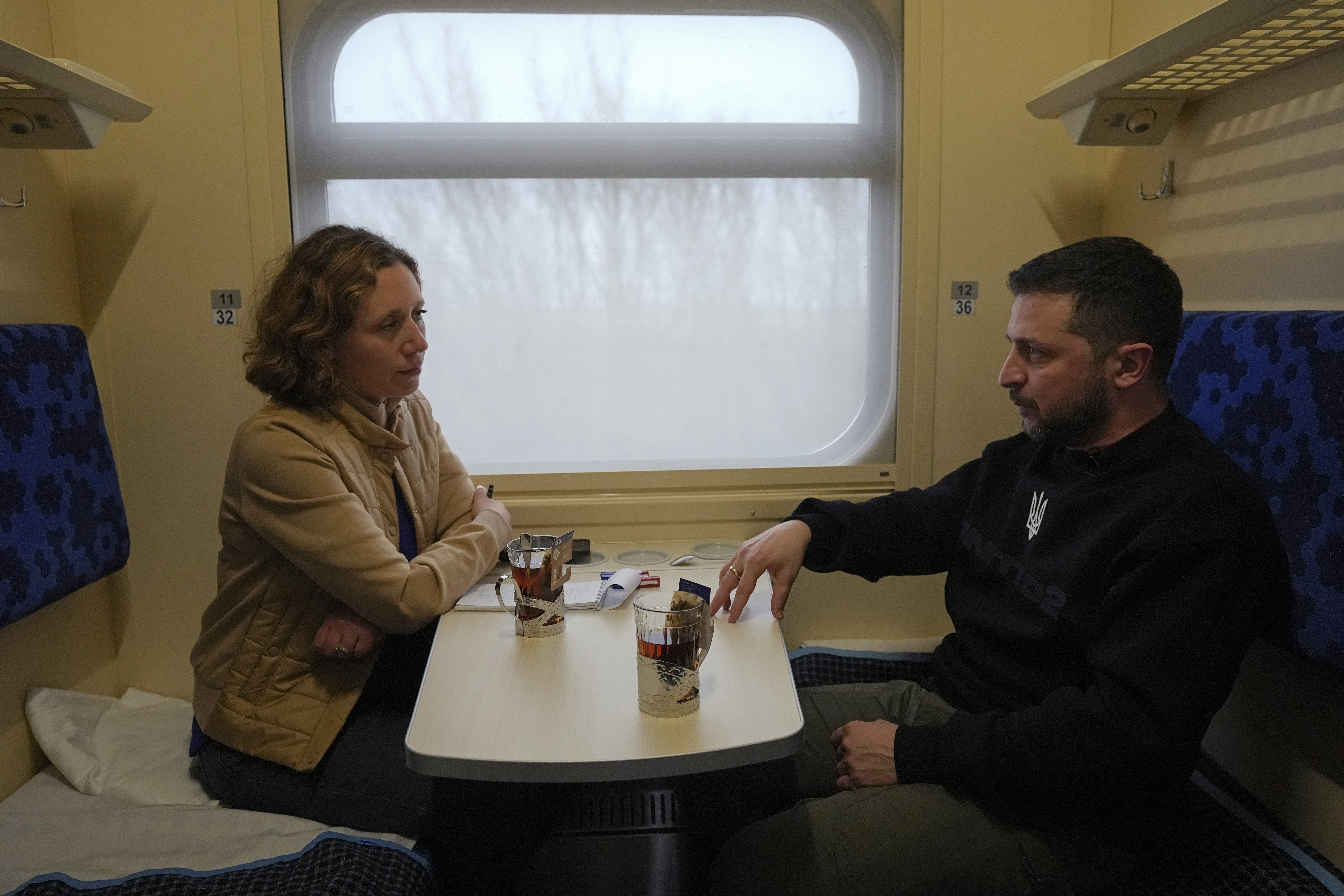 Ukraine's President Volodymyr Zelenskyy speaks in an interview with Julie Pace, vice president and editor-in-chief of The Associated Press, on a train traveling to Kiev from the Sumy region of Ukraine, Tuesday, March 28, 2023. In In the interview, Zelenskyy warned that unless his country wins a protracted battle in a key city in the east of the country, Russia could begin to build international support for a deal that would require Ukraine to make unacceptable concessions.  (AP Photo/Efrem Lukatsky)