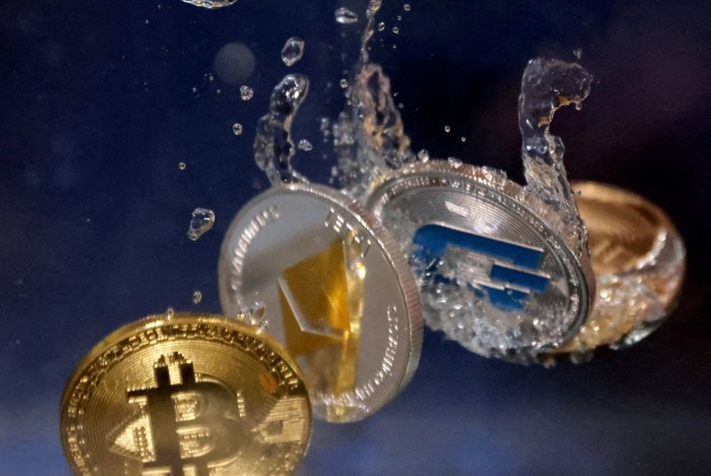 FILE PHOTO: Representations of cryptocurrencies Bitcoin, Ethereum and Dash fall into the water in this illustration, May 23, 2022. REUTERS/Dado Ruvic/Illustration/File Photo