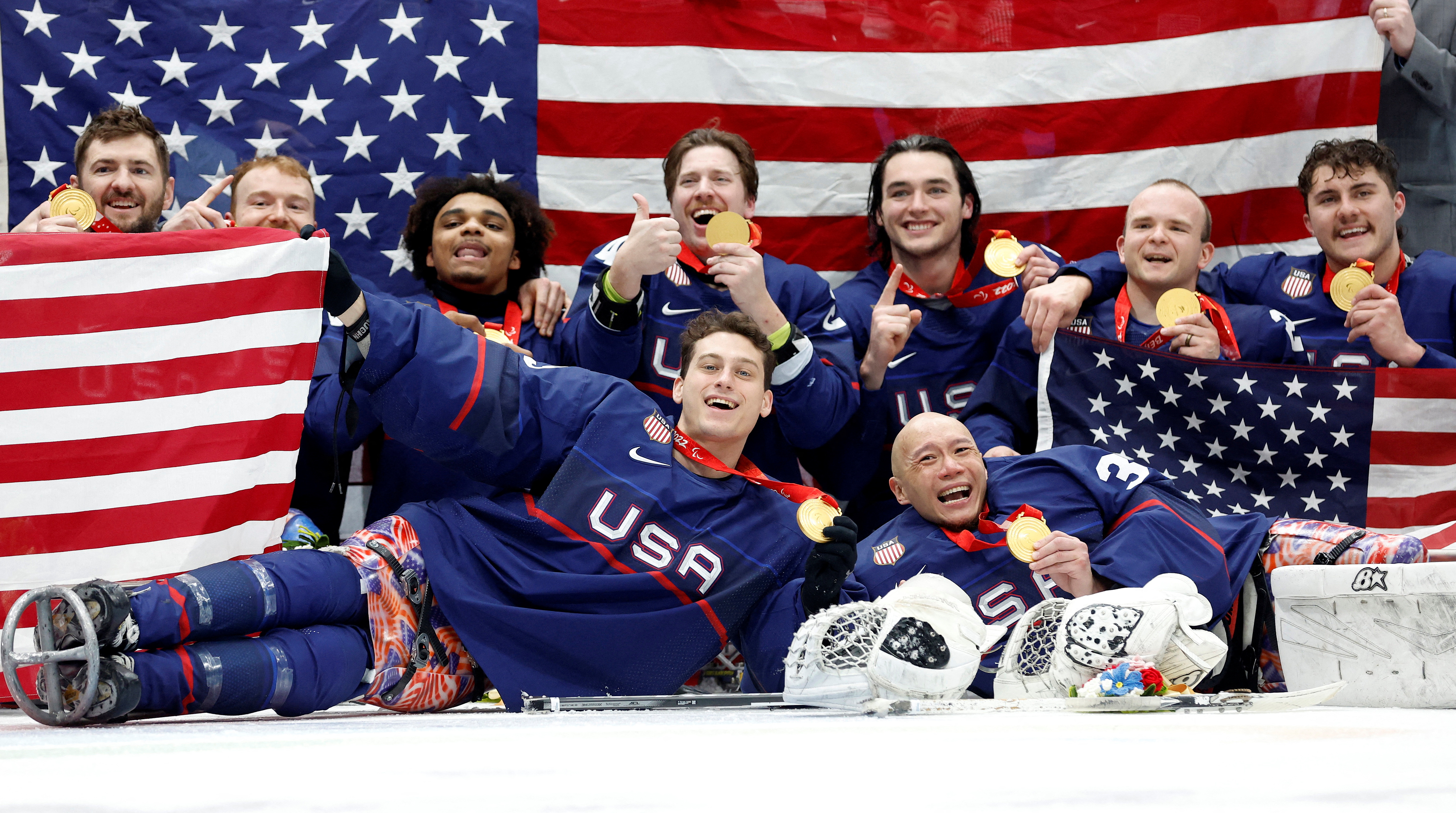 Beijing 2022 Winter Paralympic Games - Para Ice Hockey - Gold Medal Match - United States v Canada - National Indoor Stadium, Beijing, China - March 13, 2022. Gold medallists team United States players pose during the medal ceremony. REUTERS/Peter Cziborra     TPX IMAGES OF THE DAY