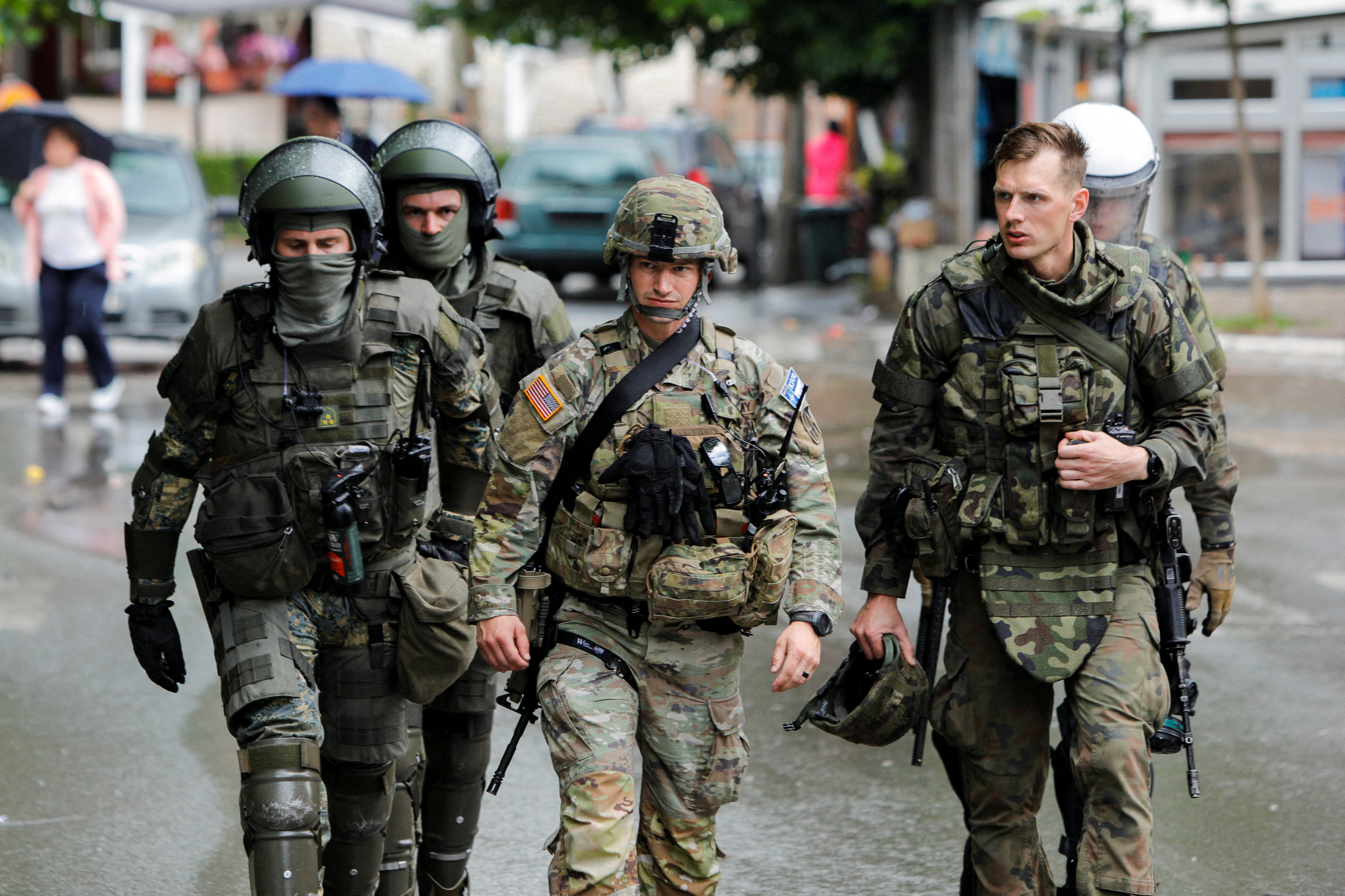 Members of the NATO-led Kosovo Force (KFOR) patrol in Zvecan