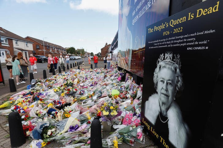 People lay flowers in memory of Elizabeth II on Shankill Road, Belfast, Northern Ireland