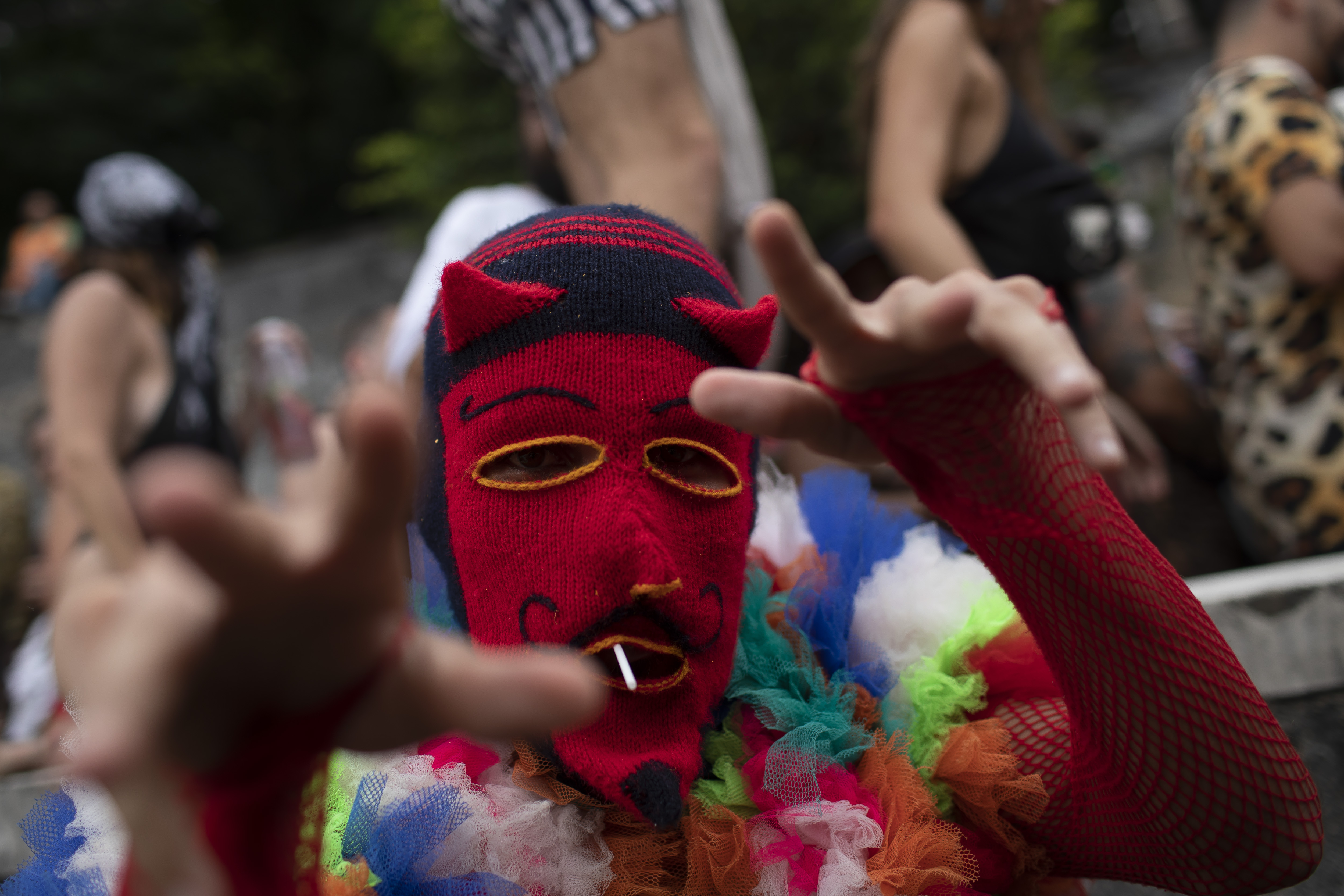 An attendee wears a Peruvian mask during a group pre-carnival street party "Saturday Has Nothing", in Rio de Janeiro, Brazil, on January 28, 2023. The world-famous Rio Carnival begins on February 17.  (AP Photo/Bruna Prado)