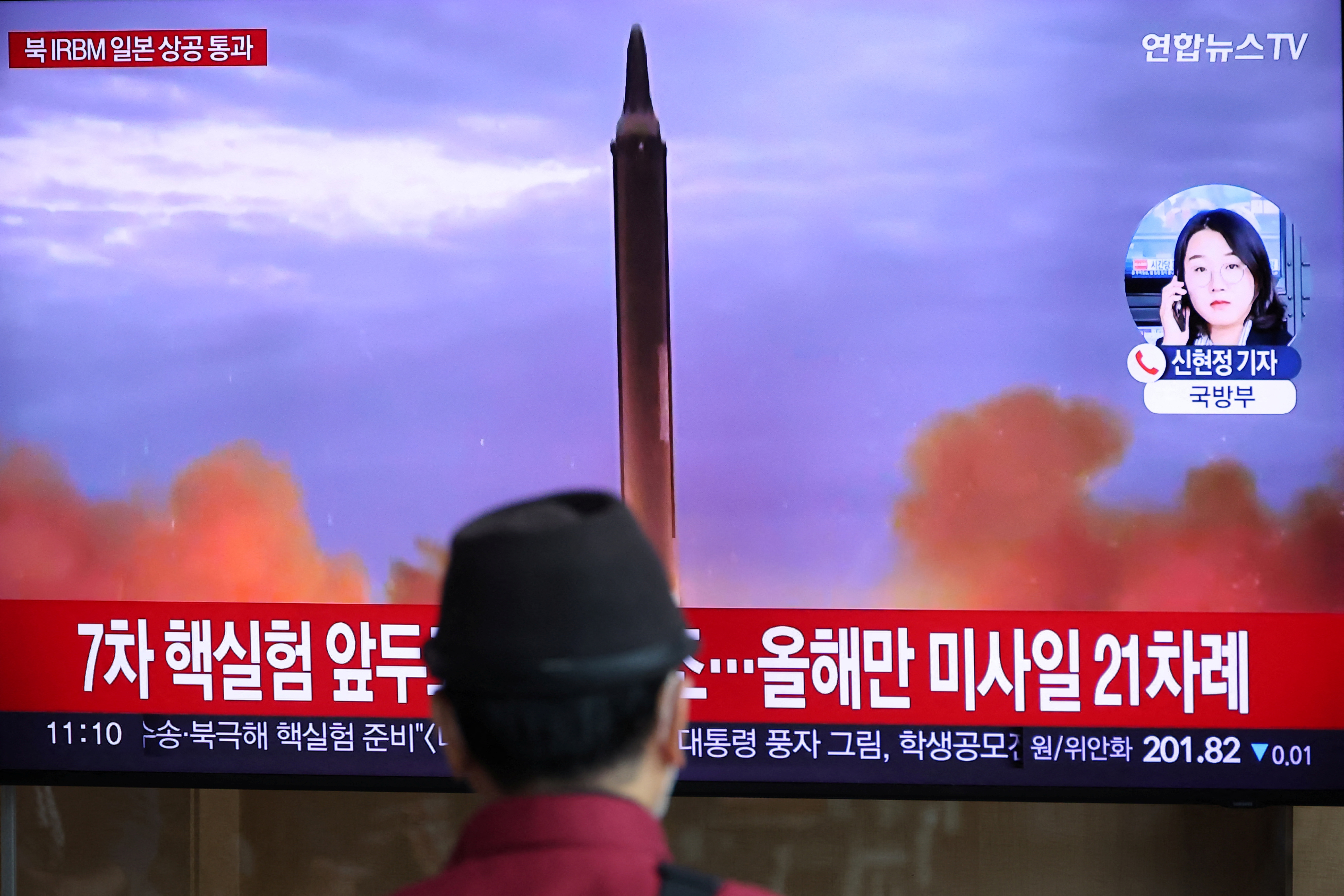 A man watches a TV broadcast in South Korea about North Korea's latest launch (Reuters)