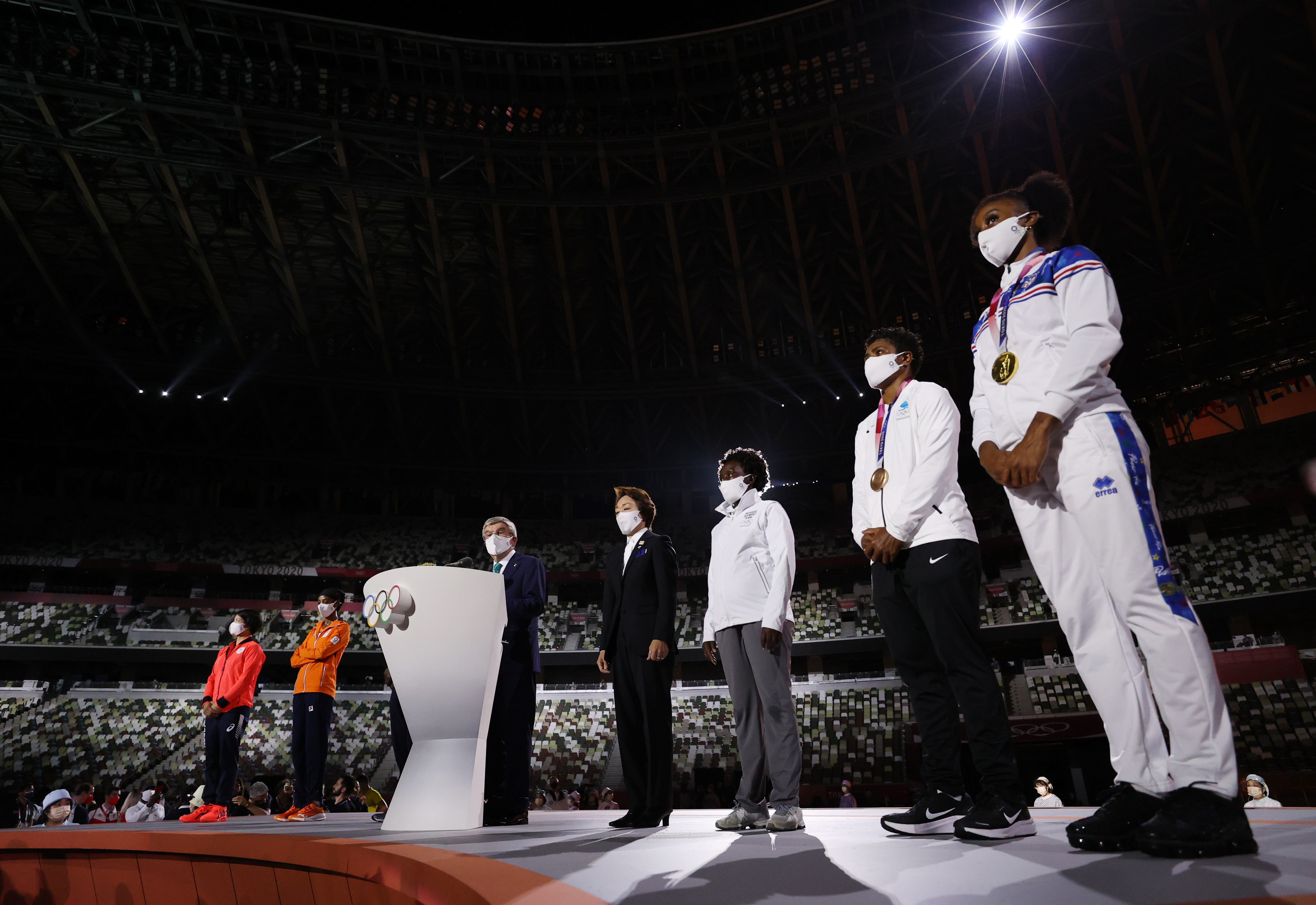 Tokyo 2020 Olympics - The Tokyo 2020 Olympics Closing Ceremony - Olympic Stadium, Tokyo, Japan - August 8, 2021. International Olympic Committee (IOC) President Thomas Bach delivers a speech as representatives from each continent and the Refugee Olympic Team look on Pool via REUTERS/Dan Mullan