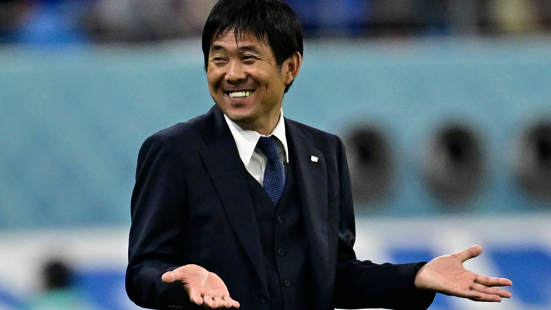 Japan's coach #00 Hajime Moriyasu reacts during the Qatar 2022 World Cup Group E football match between Japan and Spain at the Khalifa International Stadium in Doha on December 1, 2022. (Photo by JAVIER SORIANO / AFP)