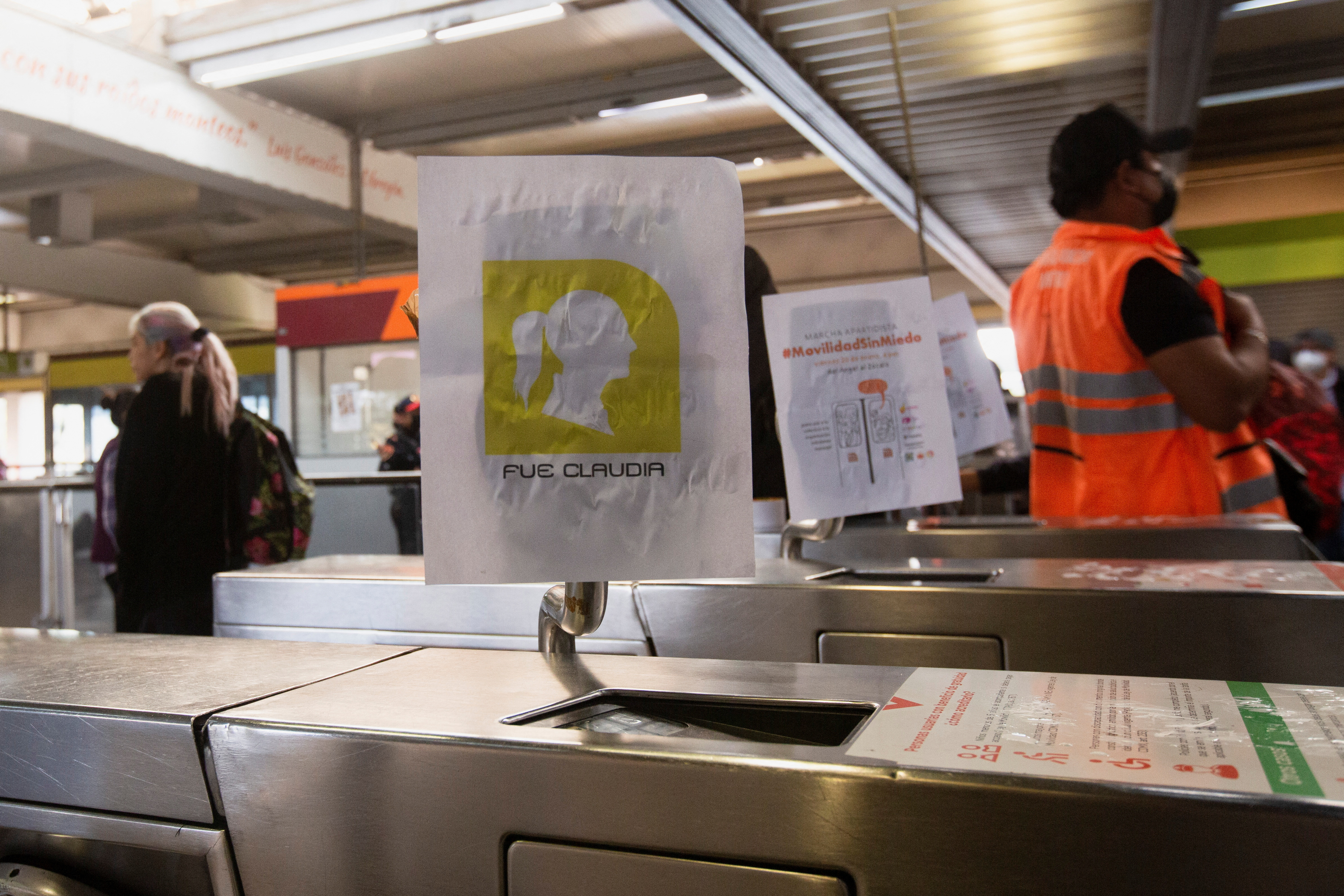 A poster with an outline of Mexico City Mayor Claudia Sheinbaum, which reads "It was Claudia", is seen on a turnstile, as part of a protest demonstrators dub "popular subway", to let people ride for free, at the Ciudad Universitaria metro station, to demand justice for Yaretzi Adriana, who died in a train crash on January 7, 2023, in Mexico City, Mexico January 12, 2023. REUTERS/Quetzalli Nicte-Ha