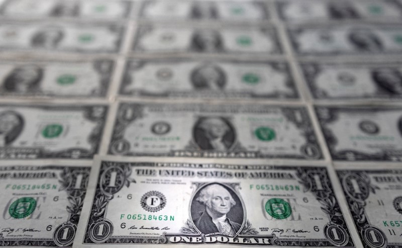 Photographic illustration of dollar bills.  February 14, 2022. REUTERS/Dado Ruvic