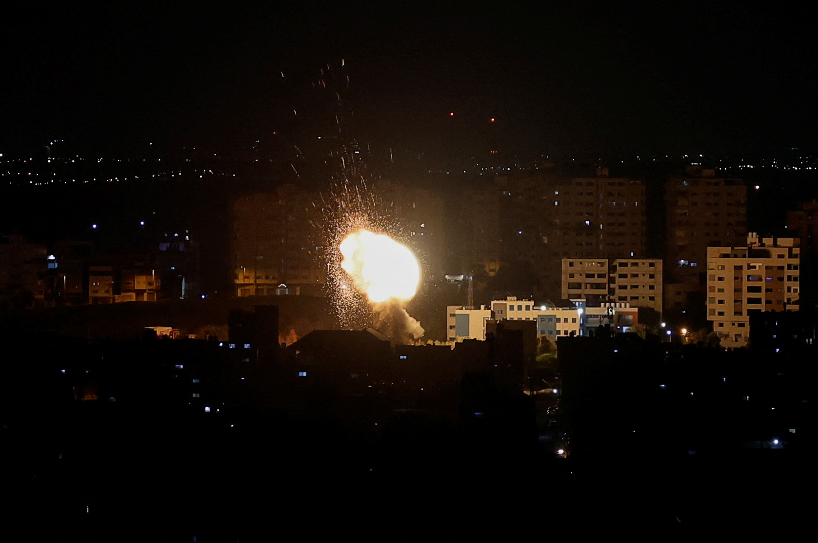 An explosion is seen, following an Israeli air strike in Gaza May 2, 2023. REUTERS/Mohammed Salem