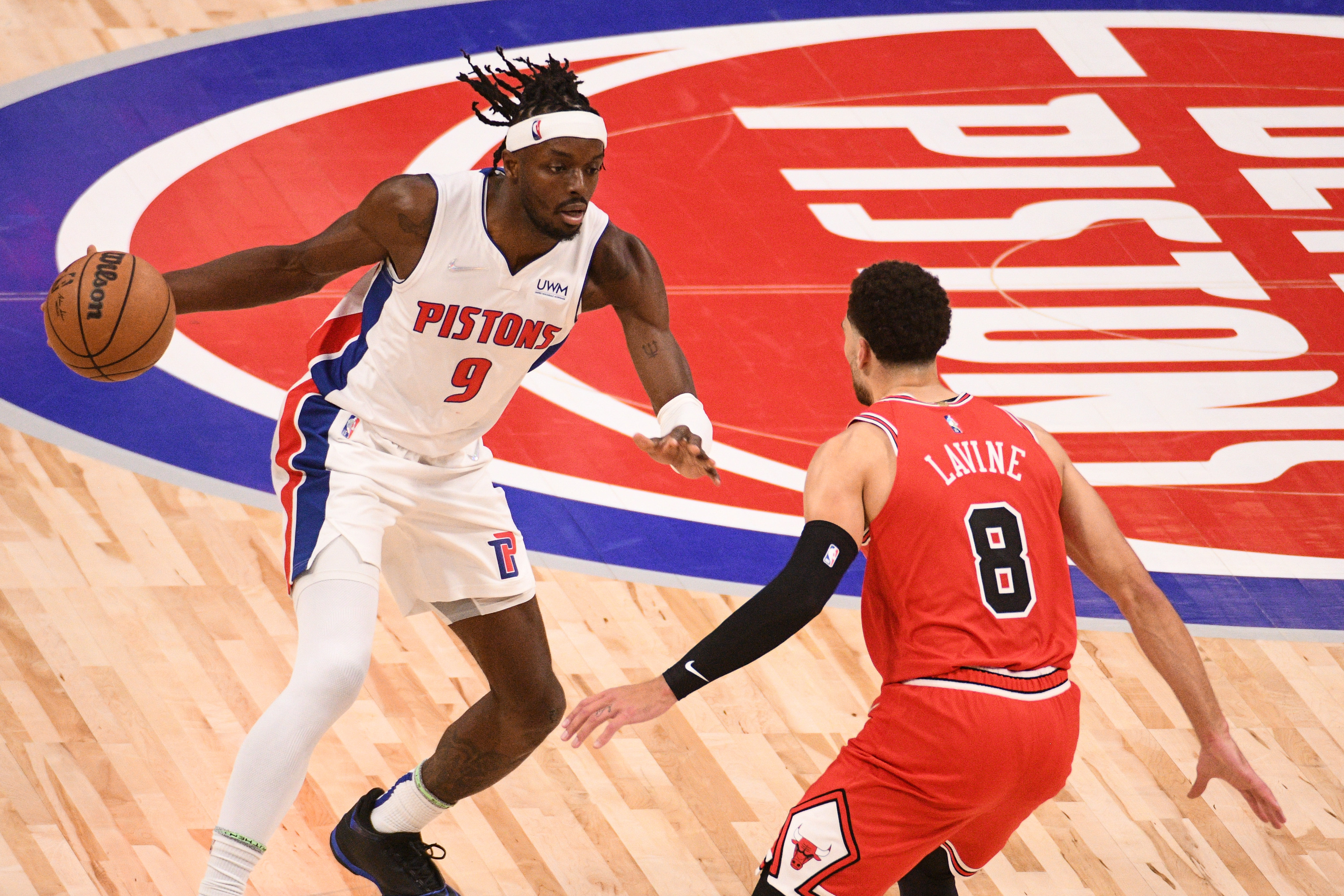 Oct 20, 2021; Detroit, Michigan, USA; Detroit Pistons forward Jerami Grant (9) drives to the basket as Chicago Bulls guard Zach LaVine (8) defends during the game at Little Caesars Arena. Mandatory Credit: Tim Fuller-USA TODAY Sports
