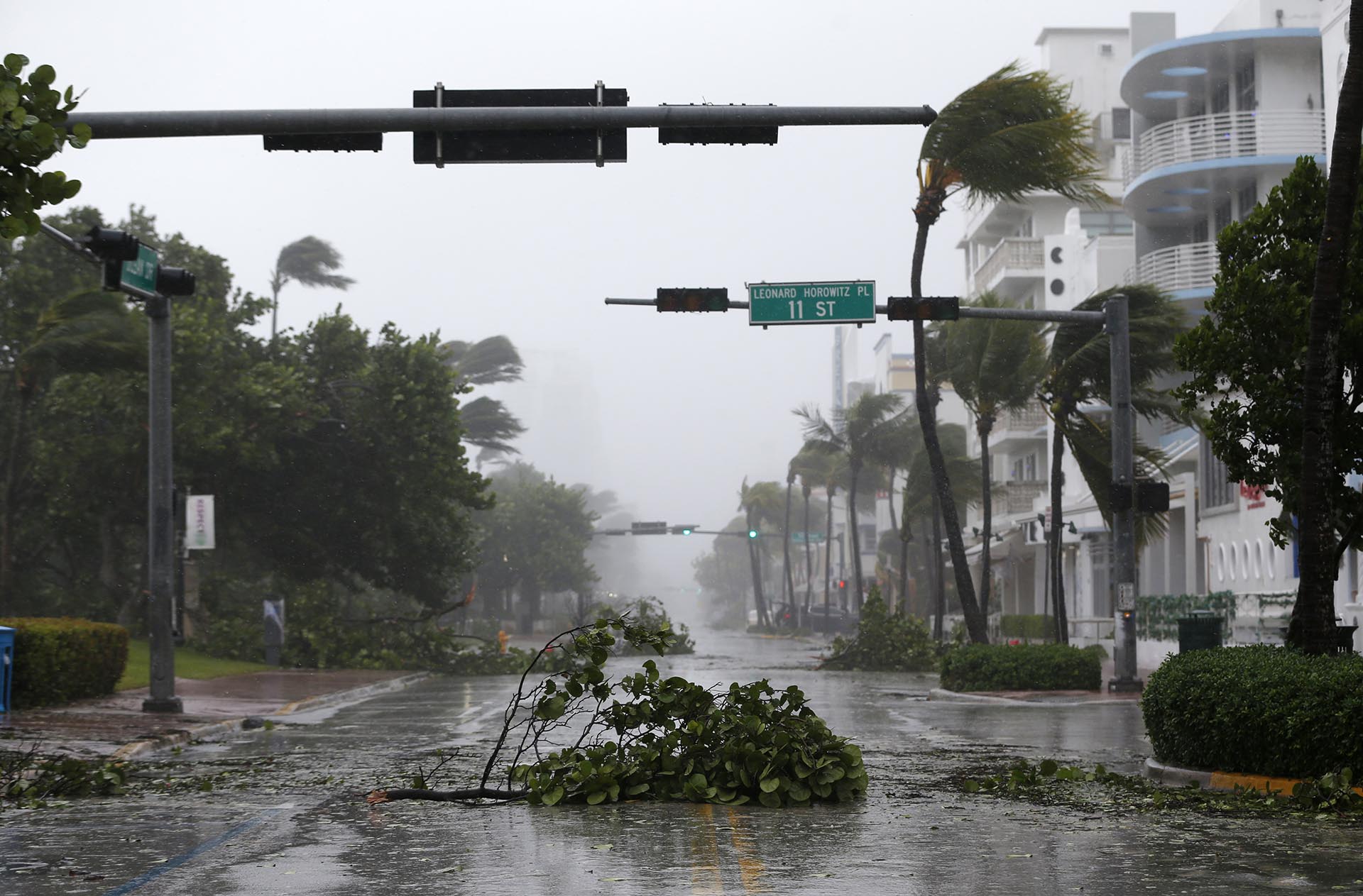 Debris is strewn across a normally busy street in South Beach as Hurricane Irma passes by, Sunday, Sept. 10, 2017, in Miami Beach, Fla. (AP Photo/Wilfredo Lee)