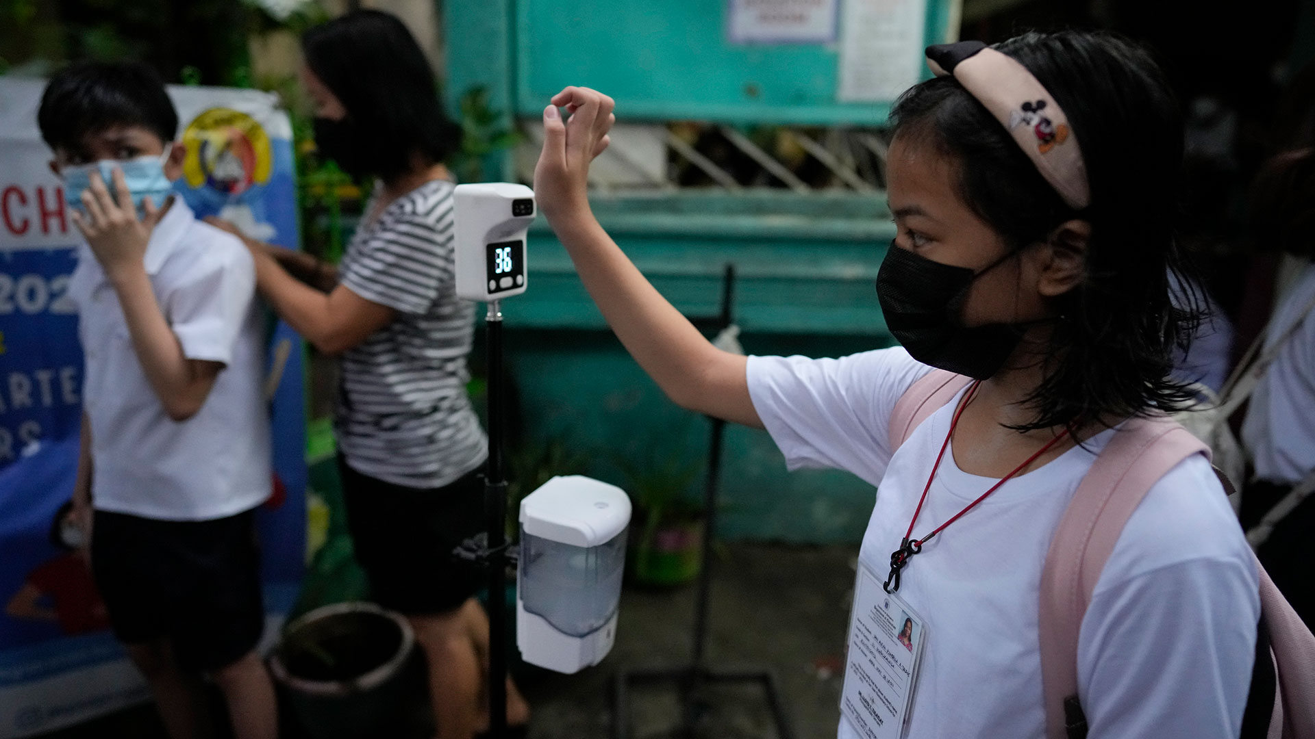 Millions of students wearing face masks returned to Philippine primary and secondary schools on Monday for their first in-person classes after two years of coronavirus lockdowns that are feared have worsened one of the world's most alarming child illiteracy rates.  (AP)