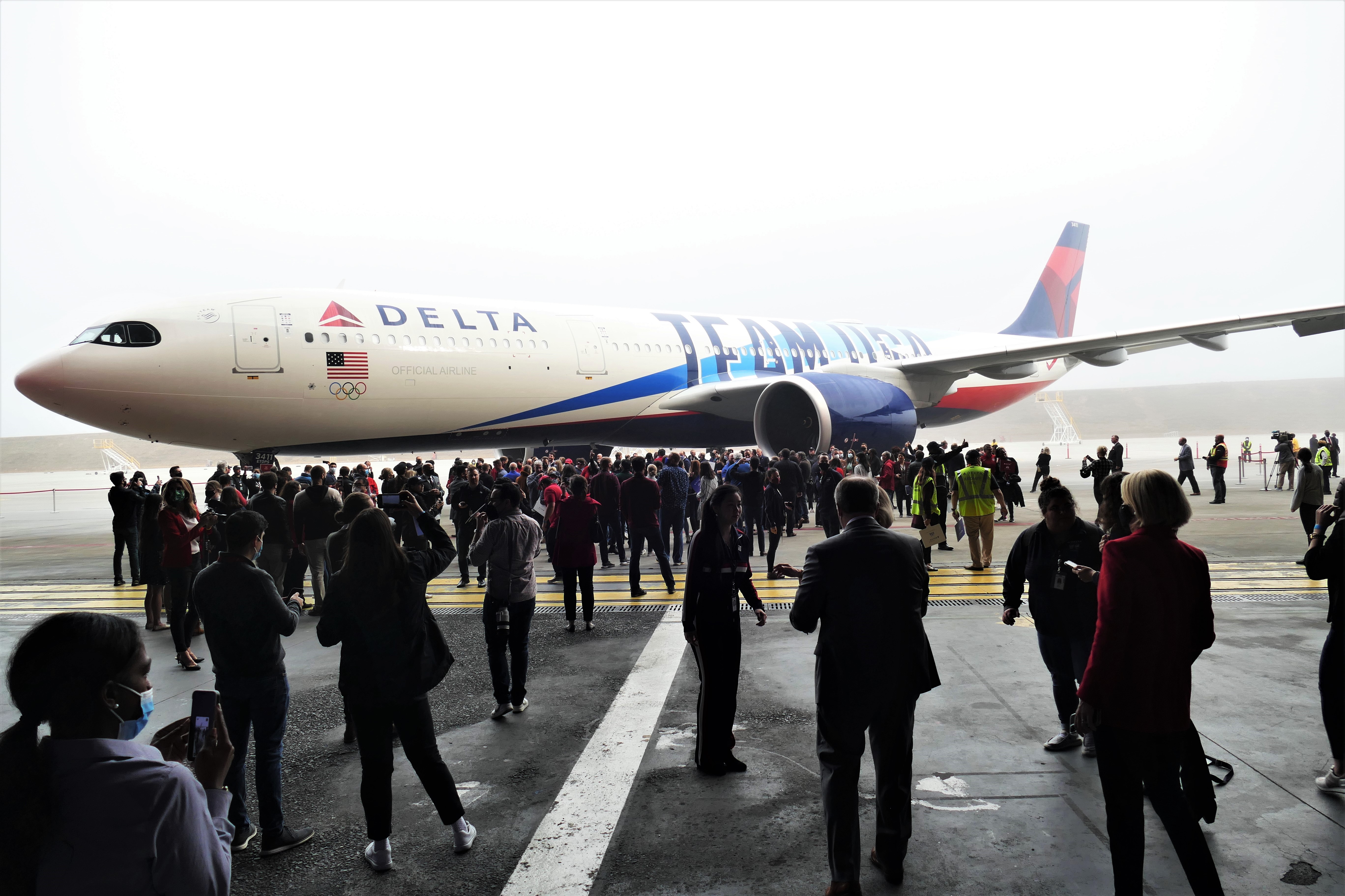 Team USA athletes pictured outside specially branded Delta Air Lines plane. Photo Credit: Shelia S. Hula