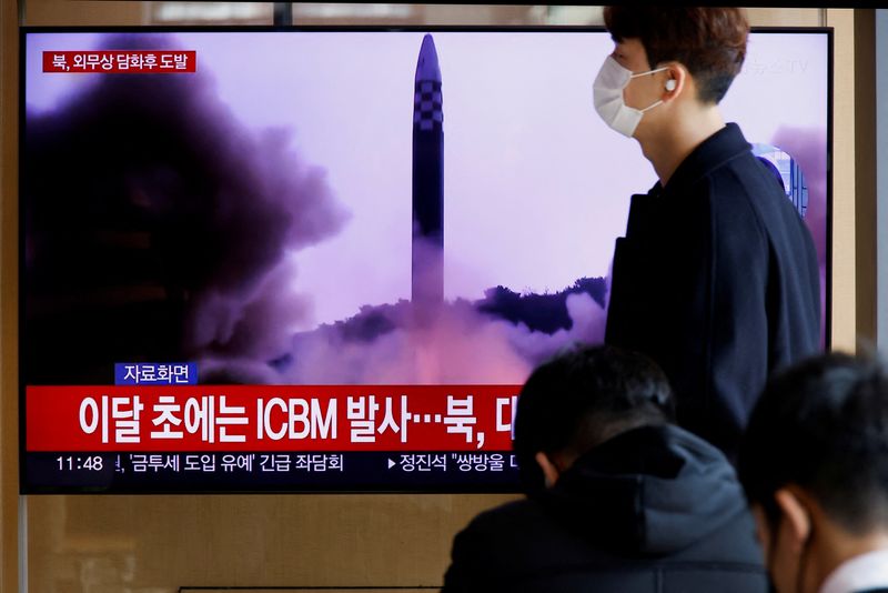 A man walks past a television showing news of North Korea's launch of a ballistic missile off its east coast in Seoul, South Korea.  November 17, 2022. REUTERS/Heo Ran/Archico