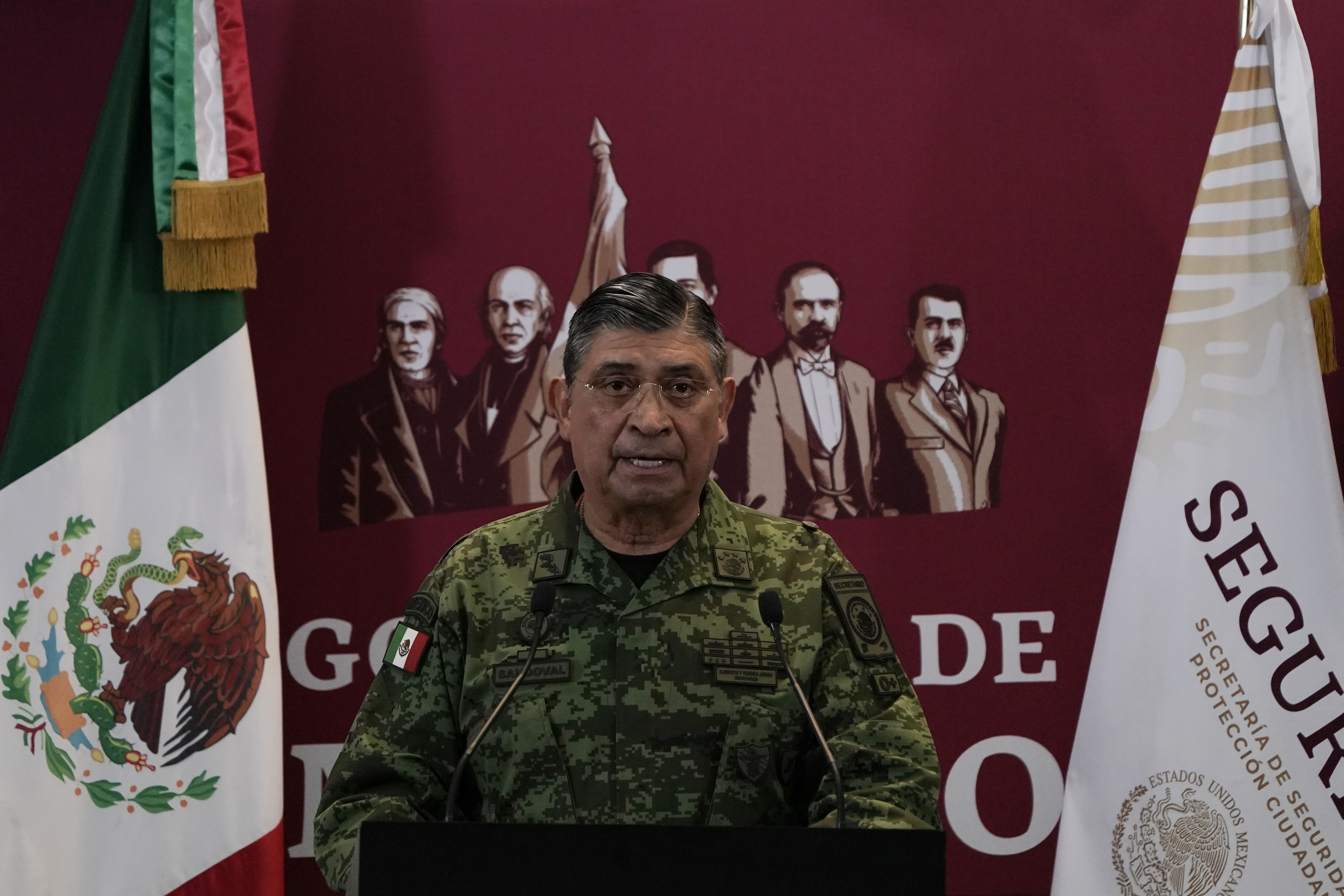 Mexico's Secretary of Defense Luis Cresencio Sandoval announces the arrest of Ovidio Guzmán during a press conference on Thursday, January 5, 2023, in Mexico City.  Mexican security forces captured Ovidio Guzmán, an alleged drug trafficker wanted by the United States and one of the sons of former Sinaloa Cartel boss Joaquín "El Chapo" Guzmán, on Thursday in a pre-dawn operation that sparked gunfire and roadblocks in the city of Culiacán.  (AP Photo/Eduardo Verdugo)