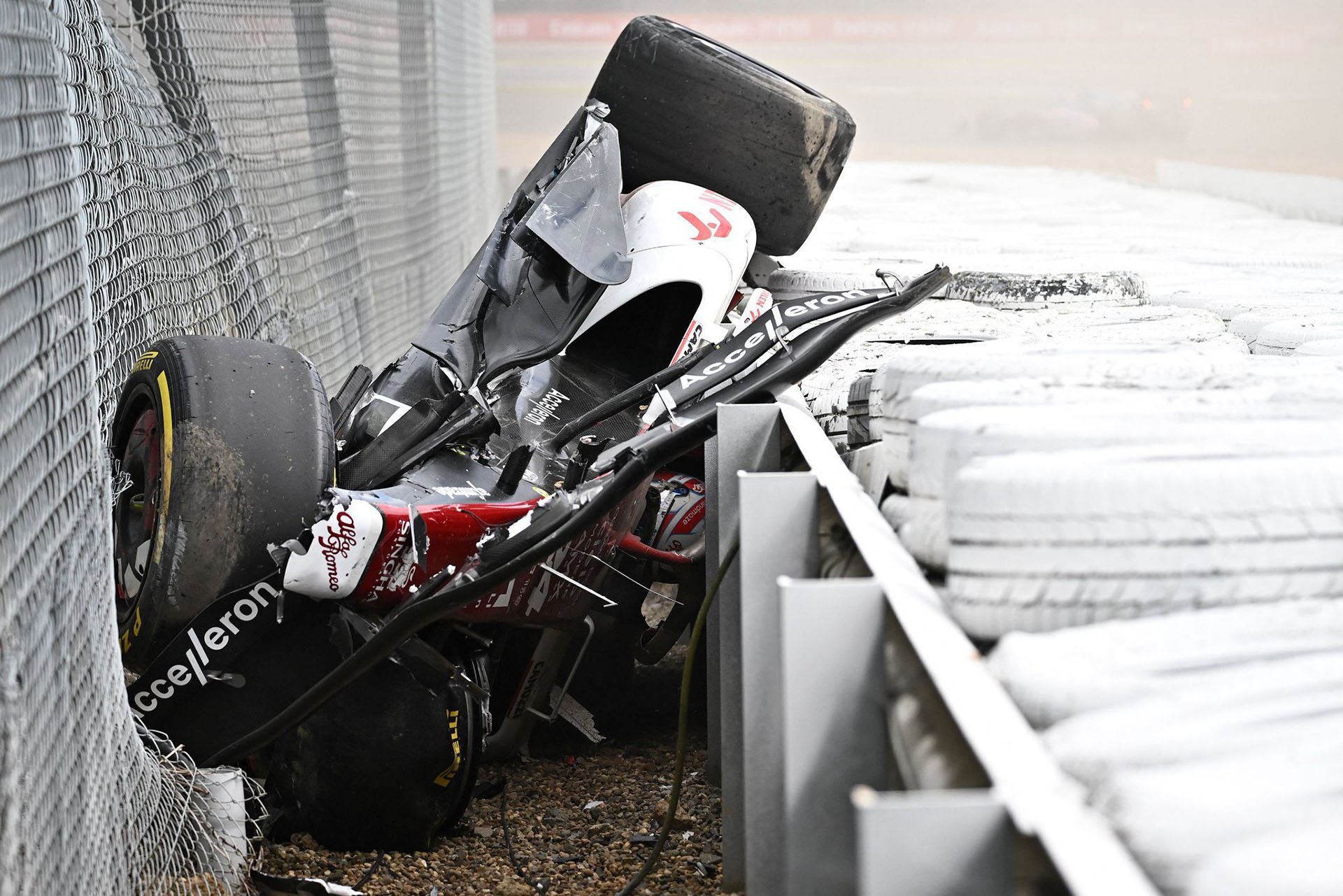 Zhou's car inverted against the guardrail, with its driver trapped and unable to get out under his own power