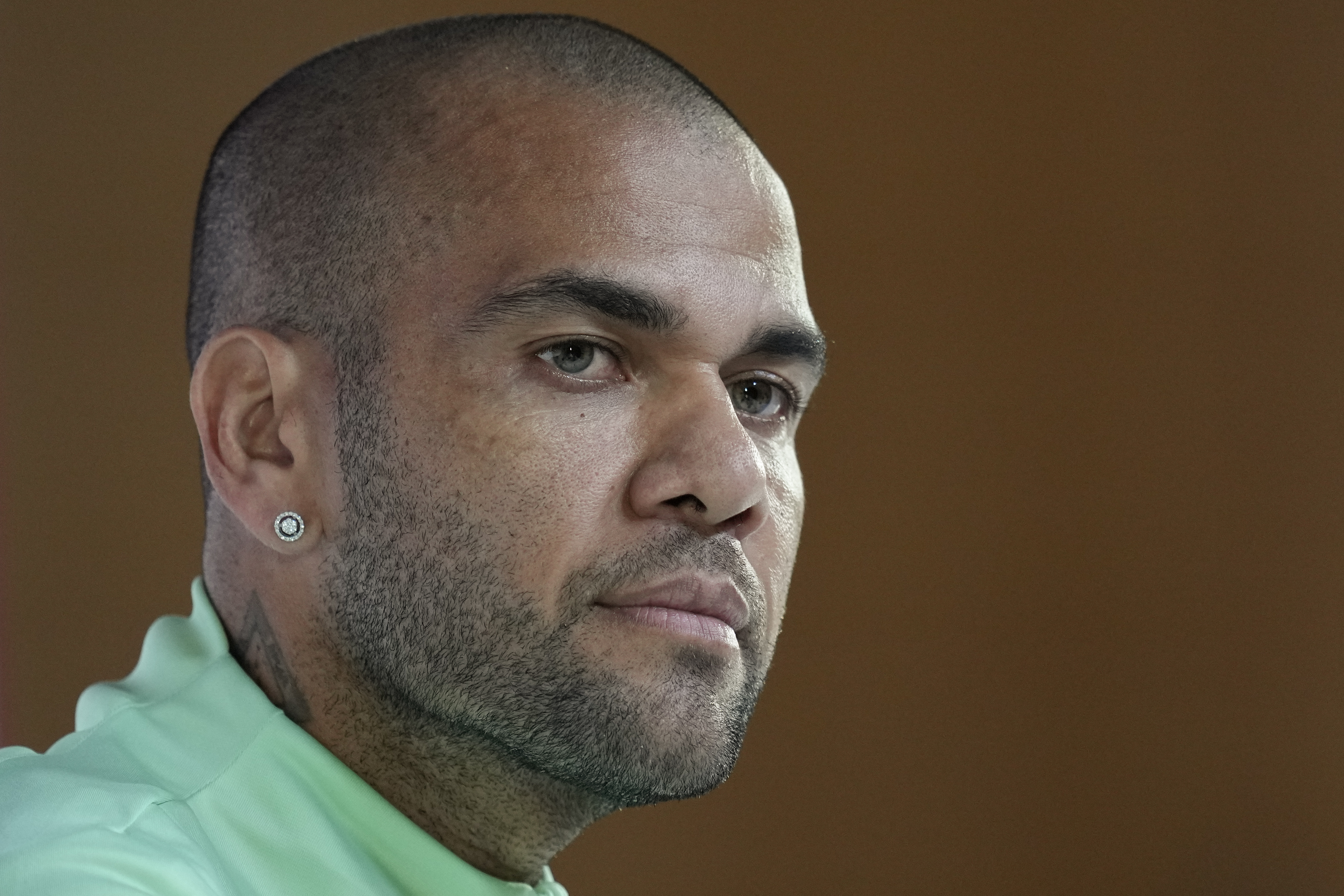 In this file photo, Brazilian soccer player Dani Alves listens to a question during a news conference before a Qatar World Cup Group G match between Brazil and Cameroon, in Doha, Qatar, December 1, 2022. (AP Photo /Andre Penner, file)