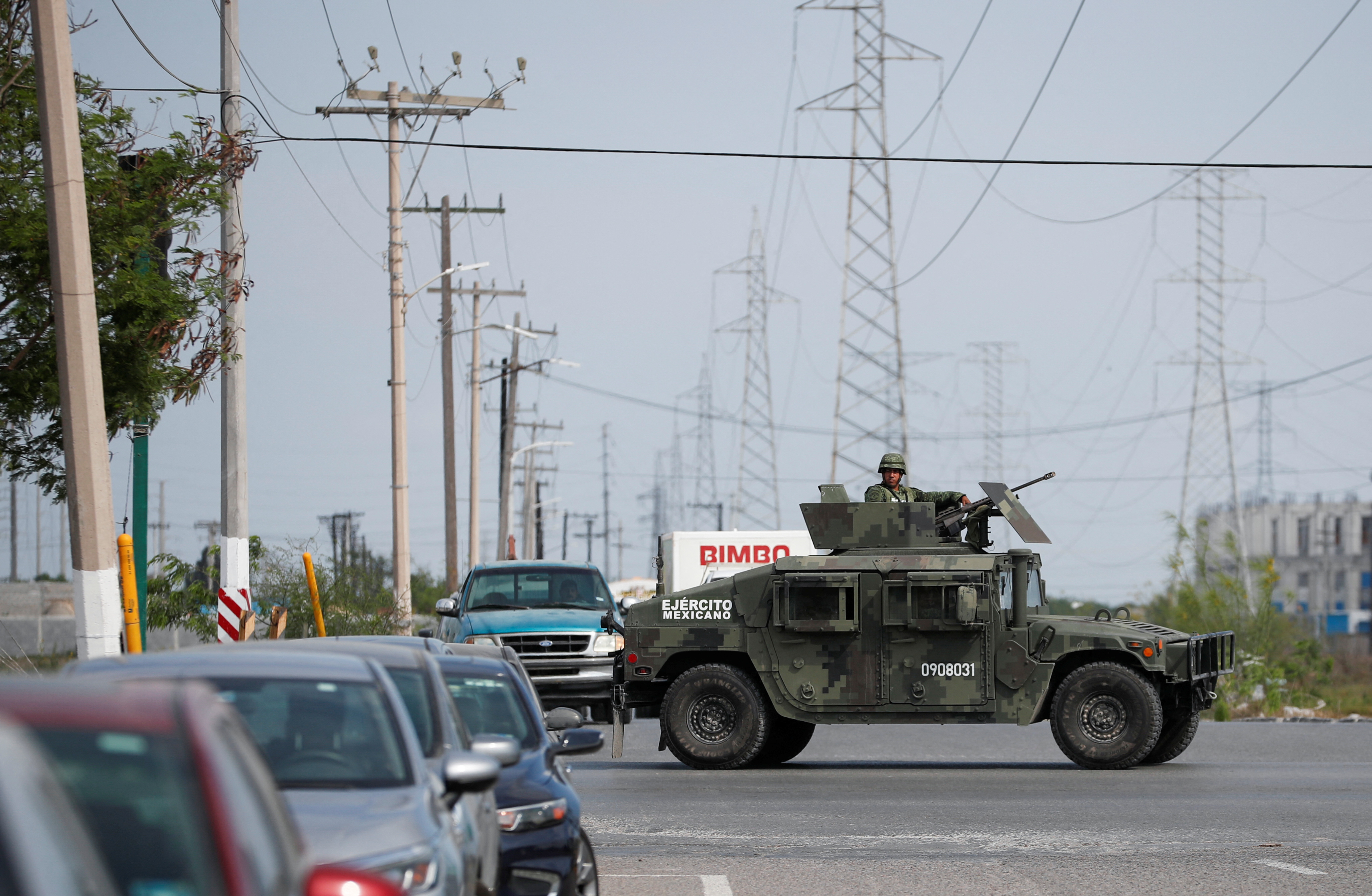Soldiers patrol near the Forensic Medical Service morgue building ahead of the transfer of the bodies of two of four Americans kidnapped by gunmen to the U.S. border, in Matamoros, Mexico, March 9, 2023. REUTERS/Daniel Becerril