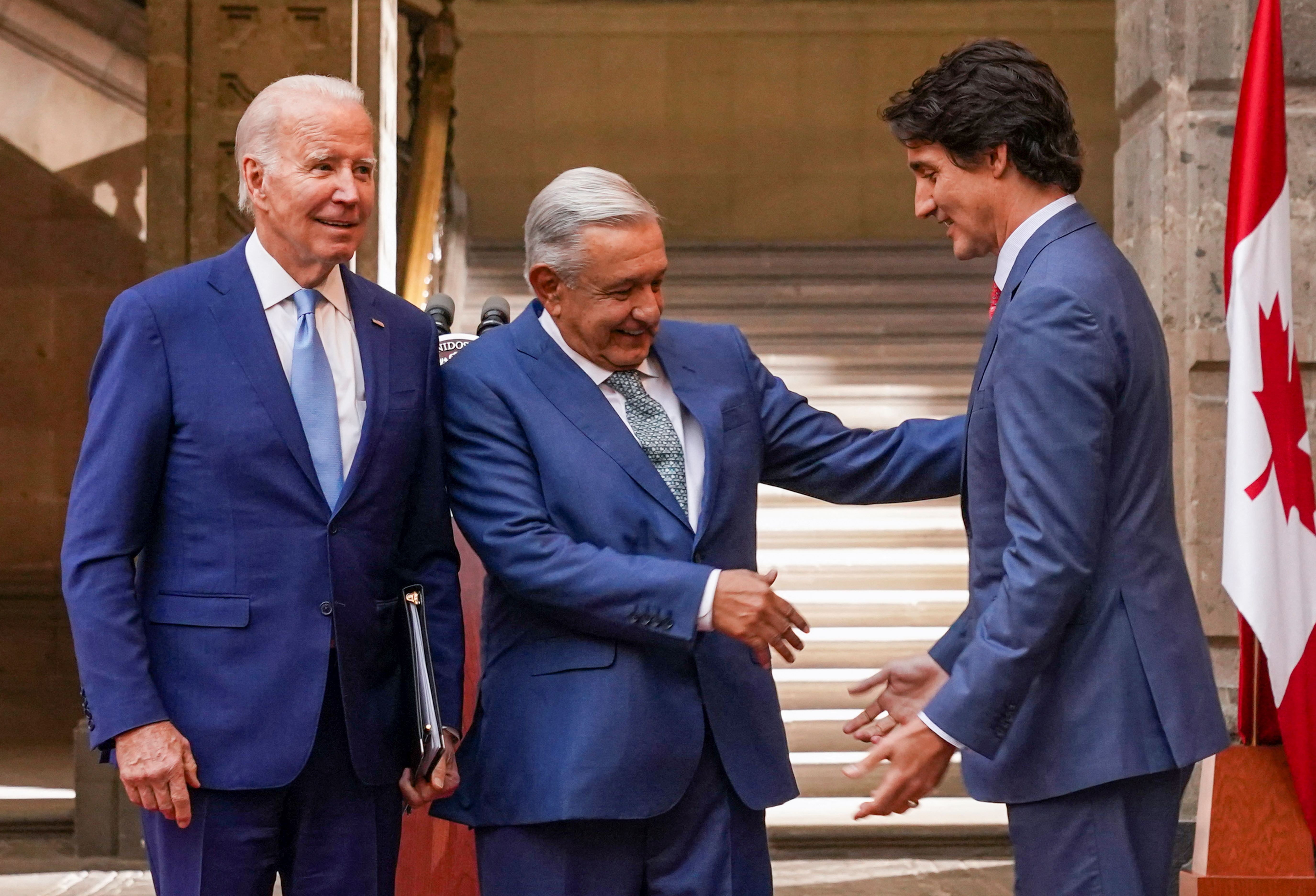 Mexican President Andres Manuel Lopez Obrador greets Canadian Prime Minister Justin Trudeau next to US President Joe Biden at the conclusion of the North American Leaders' Summit in Mexico City, Mexico, January 10, 2023. REUTERS/Kevin Lamarque
