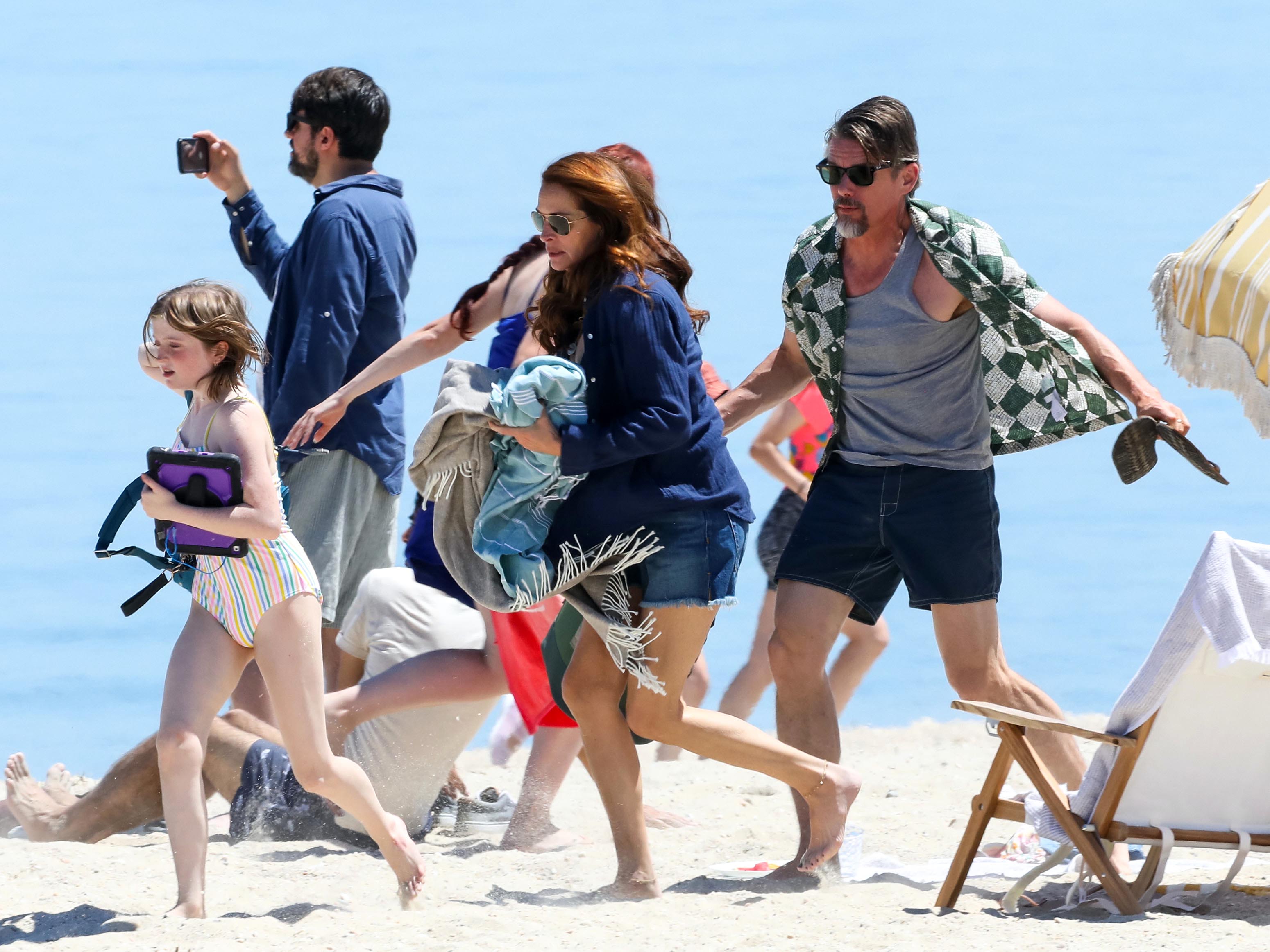 Workday.  Julia Roberts and Ethan Hawke were photographed on set as they filmed a dramatic beach scene on New York's Sunken Beach Parkway for "Leave the World Behind"