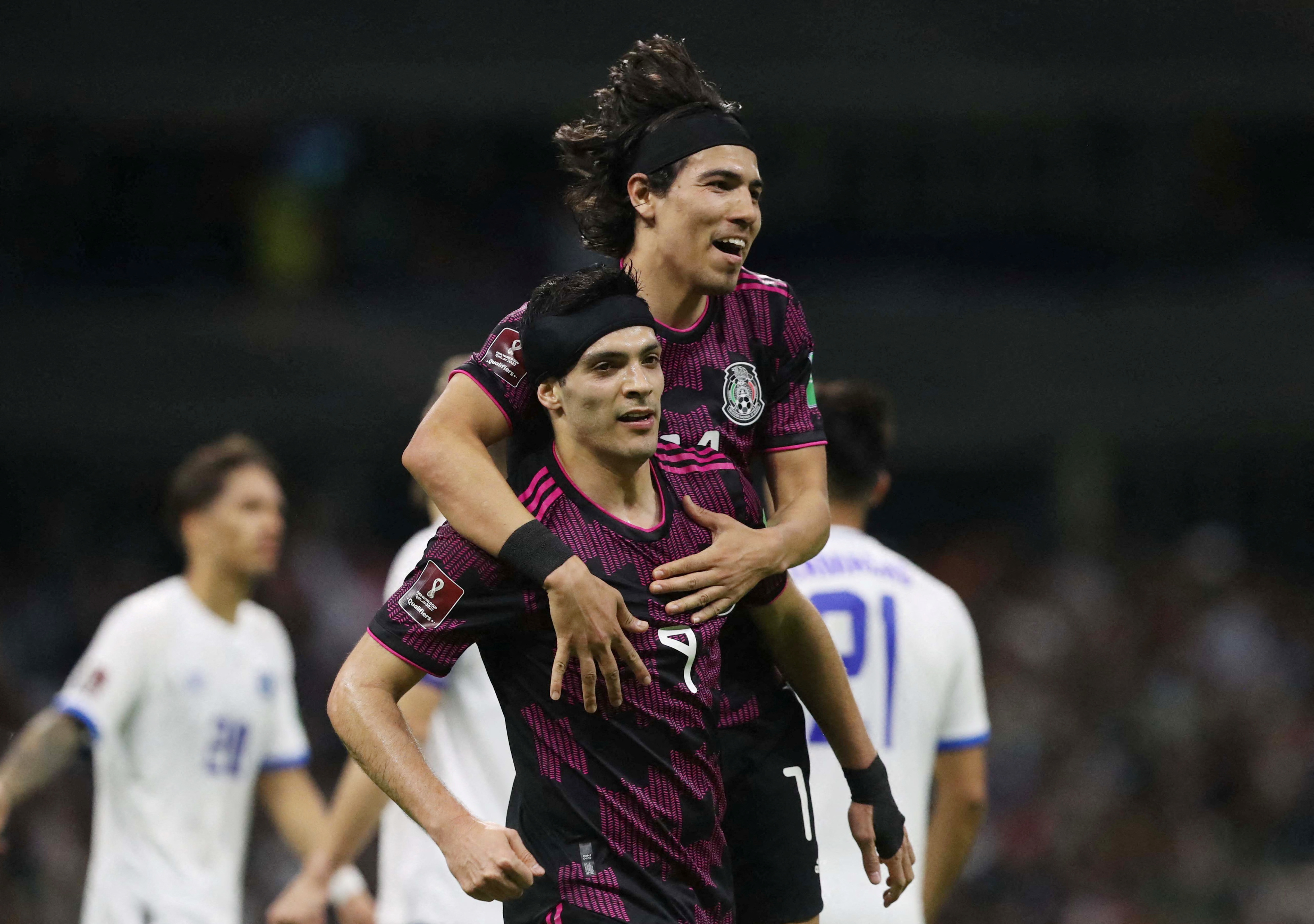 Soccer Football - World Cup - Concacaf Qualifiers - Mexico v El Salvador - Estadio Azteca, Mexico City, Mexico - March 30, 2022 Mexico's Raul Jimenez celebrates scoring their second goal with Erick Gutierrez REUTERS/Edgard Garrido