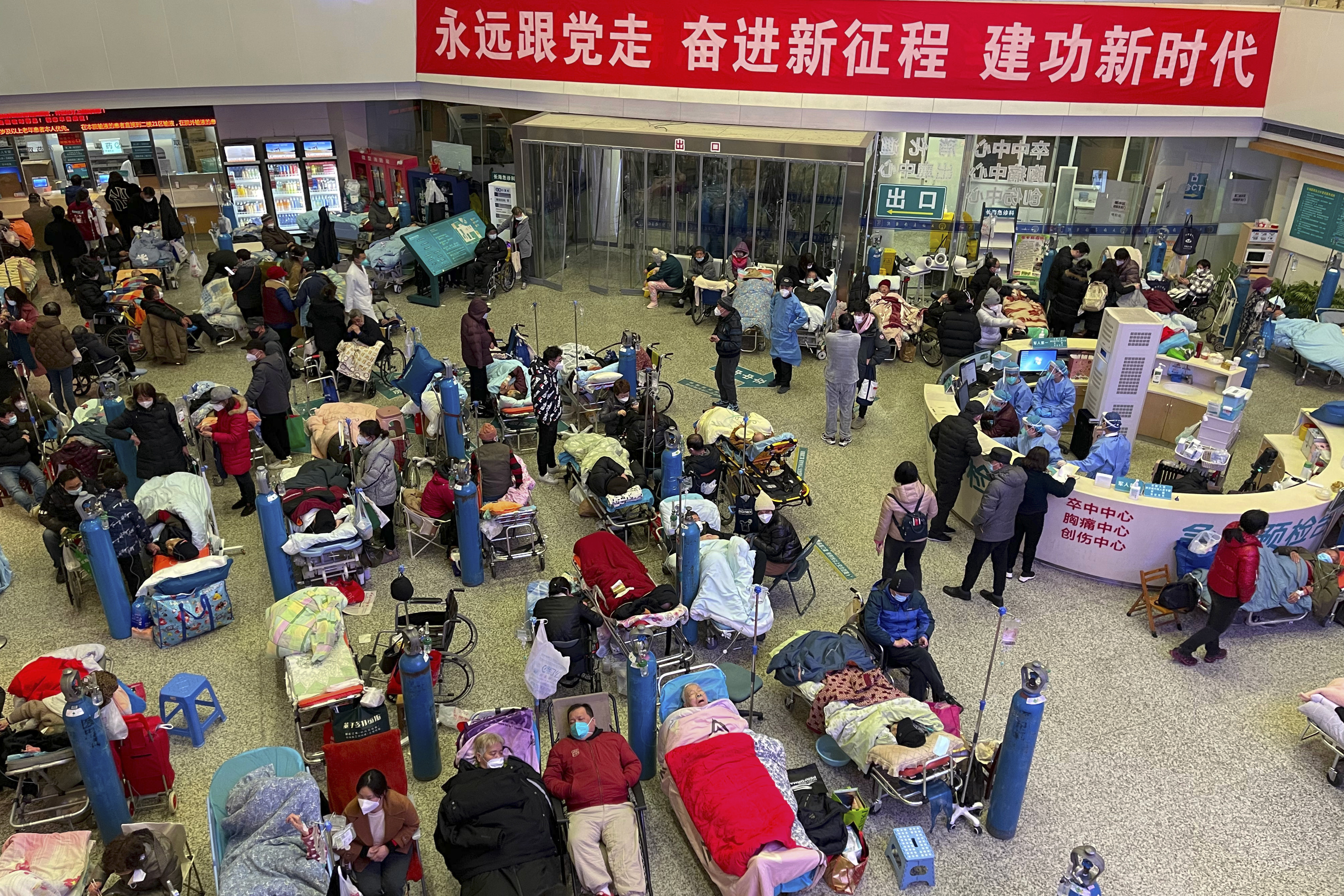Patients, mostly older adults with COVID symptoms, congregate in a ward at Shanghai Hospital for medical care